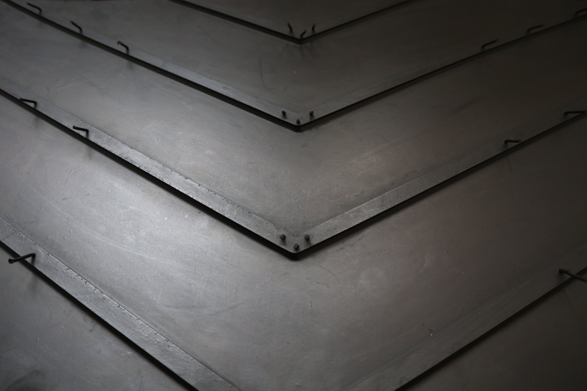 Close-up of a profile conveyor belt with a V shaped cleat.