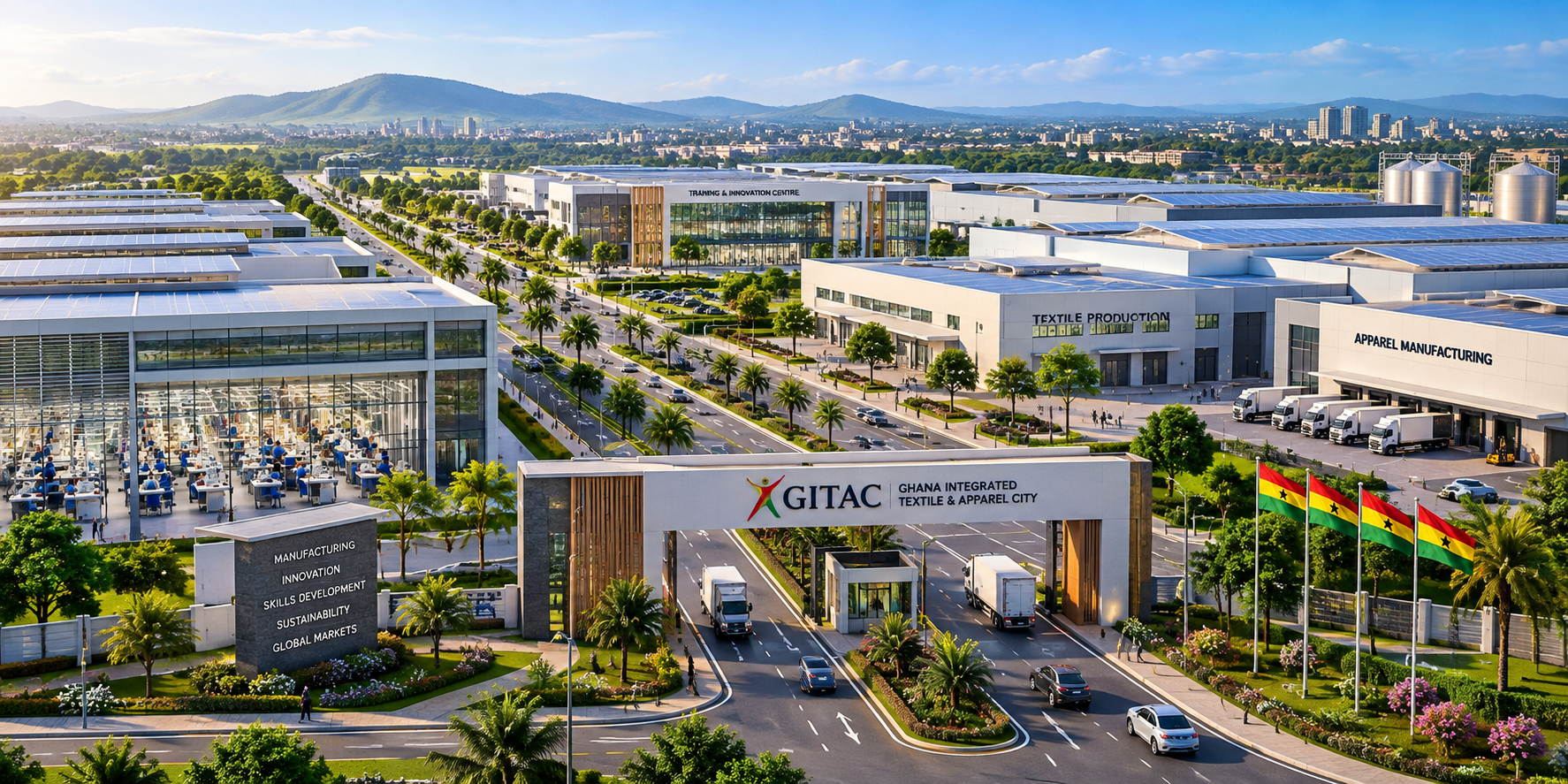 Aerial view of the Ghana International Textile & Apparel City featuring modern buildings, palm trees, flags, and trucks, with mountains in the background.
