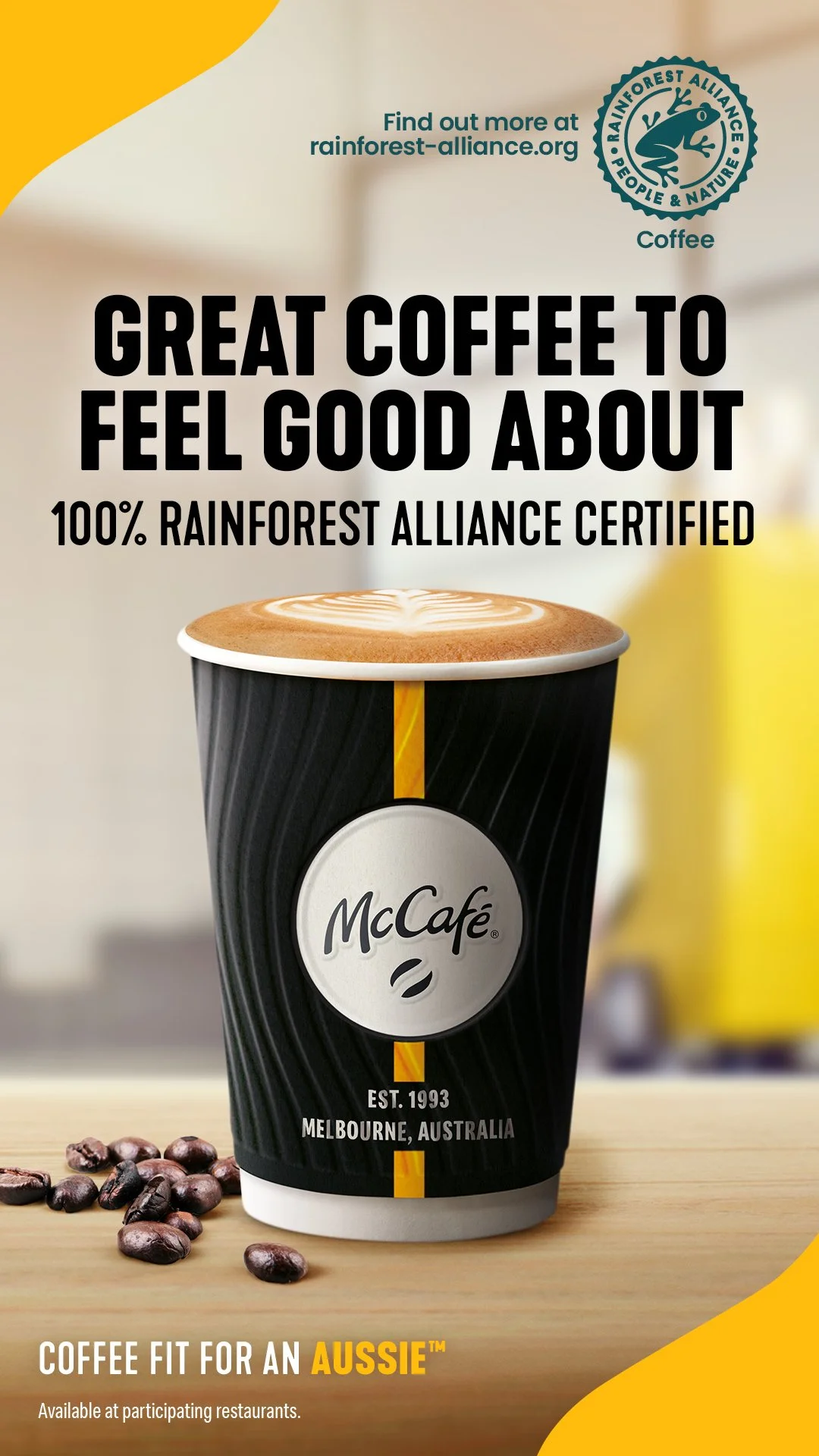 McCafé coffee cup with coffee beans and text promoting 100% Rainforest Alliance certified coffee in Australia