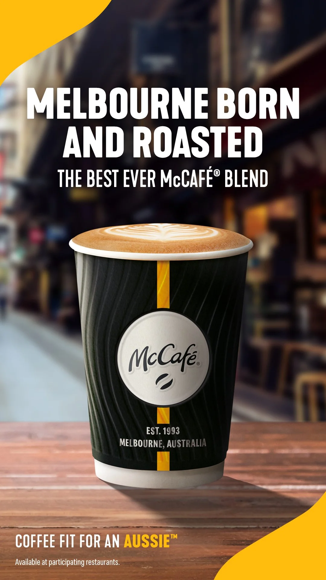 McCafé promotional poster featuring a latte in a black cup, with text reading “Melbourne Born and Roasted” and “Coffee Fit for an Aussie.”