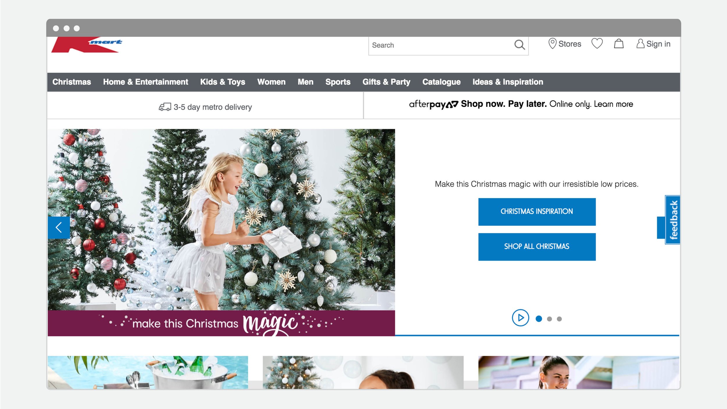 Online department store Christmas homepage featuring a girl holding a gift among decorated Christmas trees