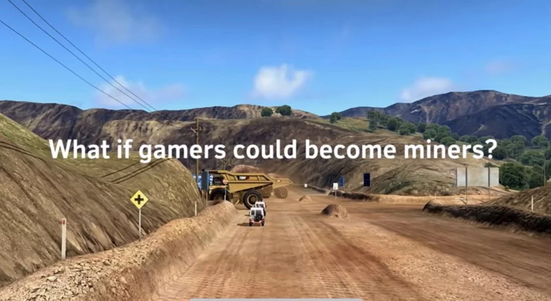 Text on a dirt road in a mountainous area with some vehicles and power lines, reading 'What if gamers could become miners?'