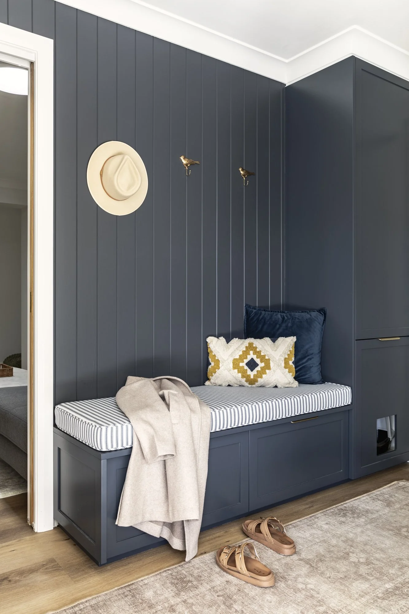 Navy panelled mud room with bench seat, Albion Park