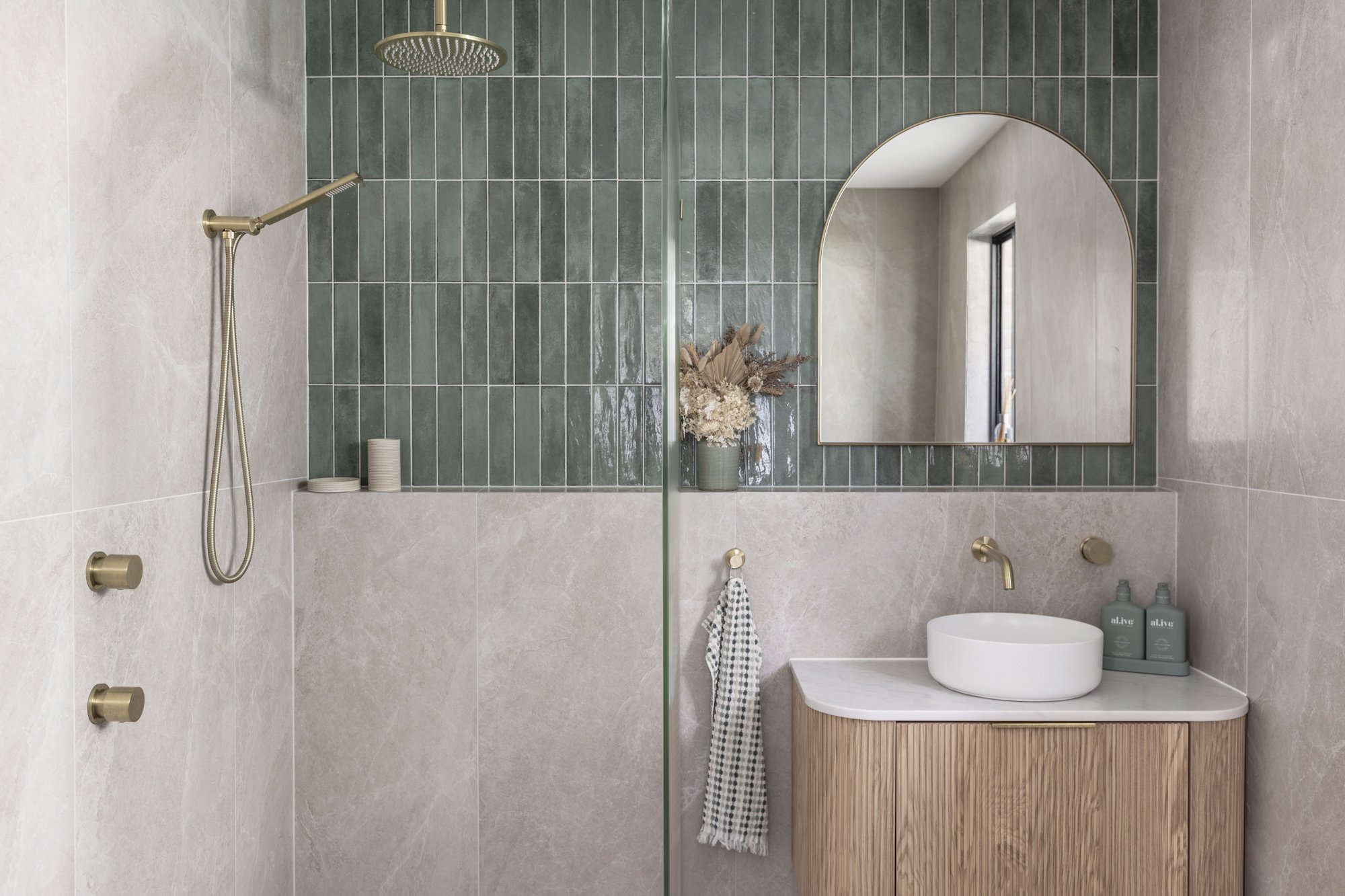 Sage green tiled ensuite with brushed brass tapware, Albion Park