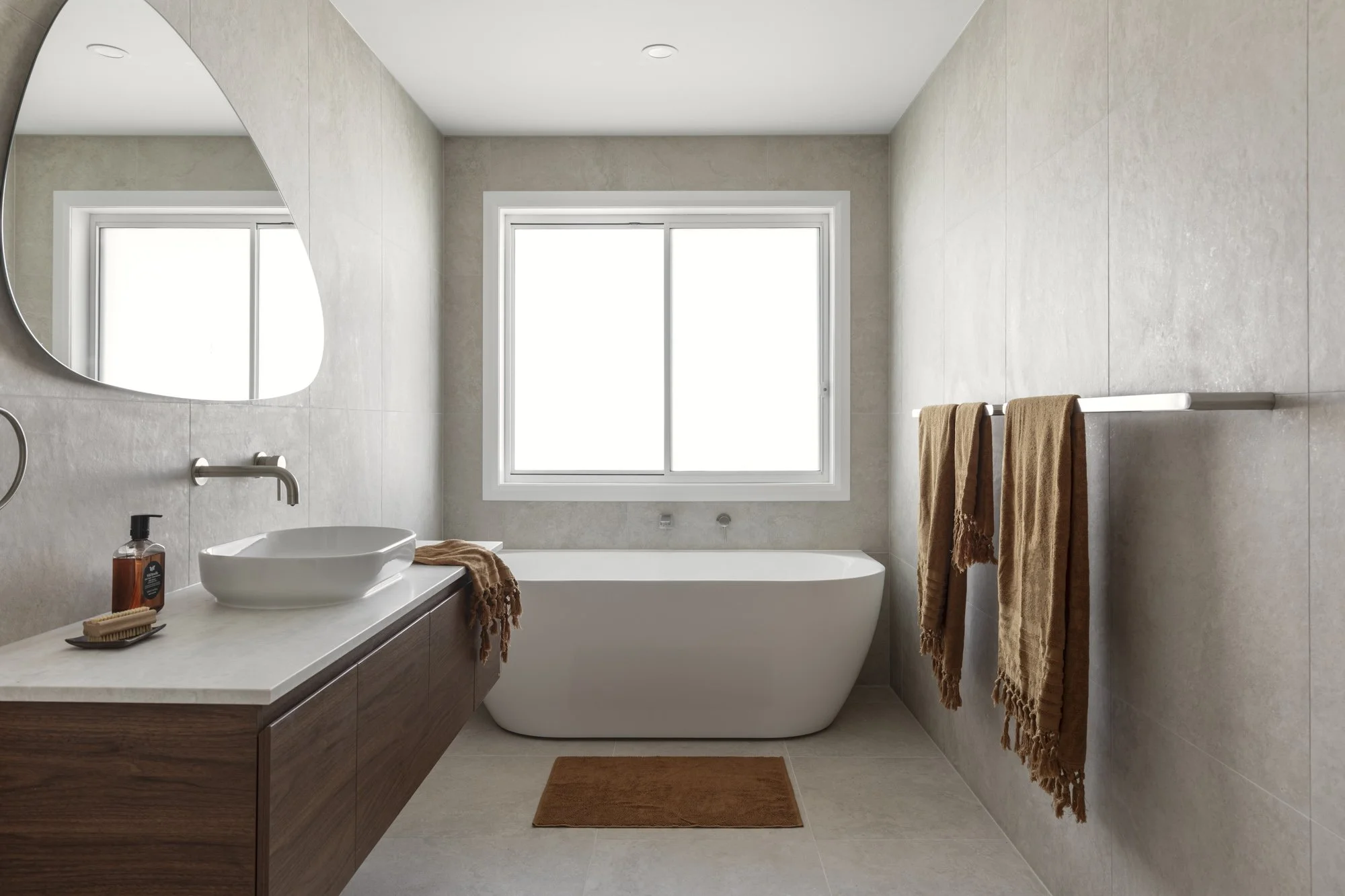 Main bathroom with back to wall bath and walnut floating vanity, Corrimal