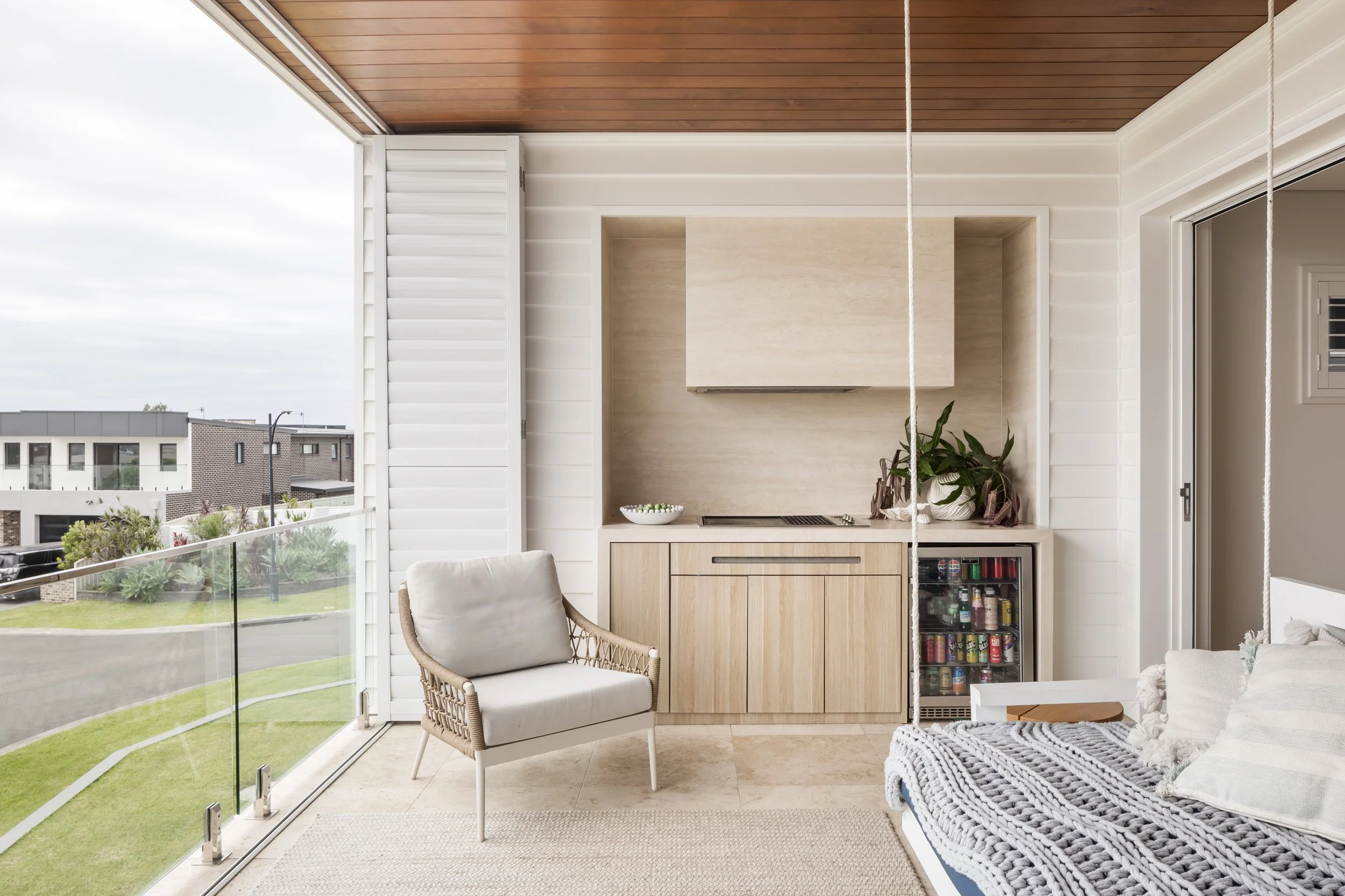 Reclad upstairs balcony with travertine outdoor kitchen, Shell Cove