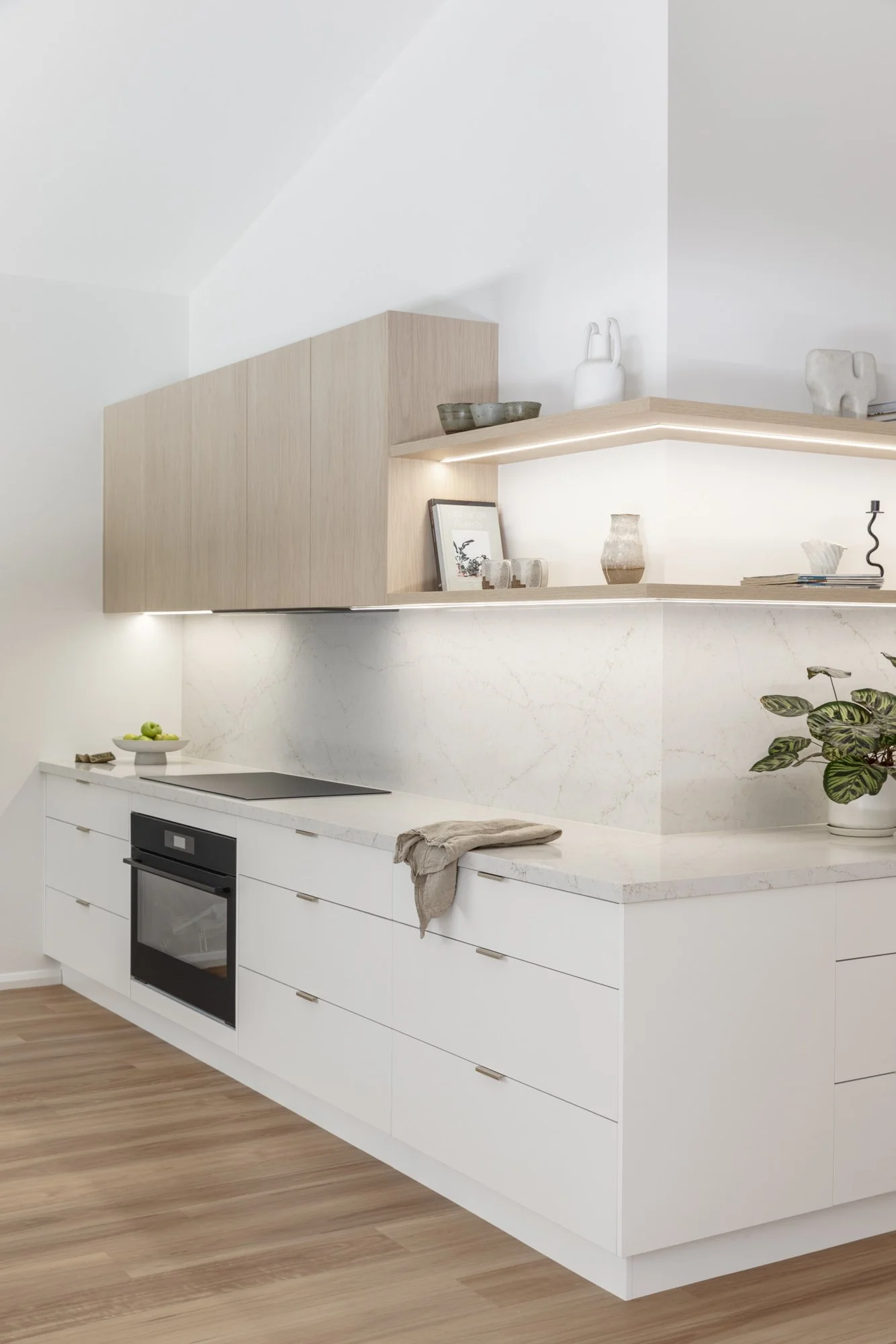 Oak floating shelves with LED lighting and stone splashback, Corrimal kitchen