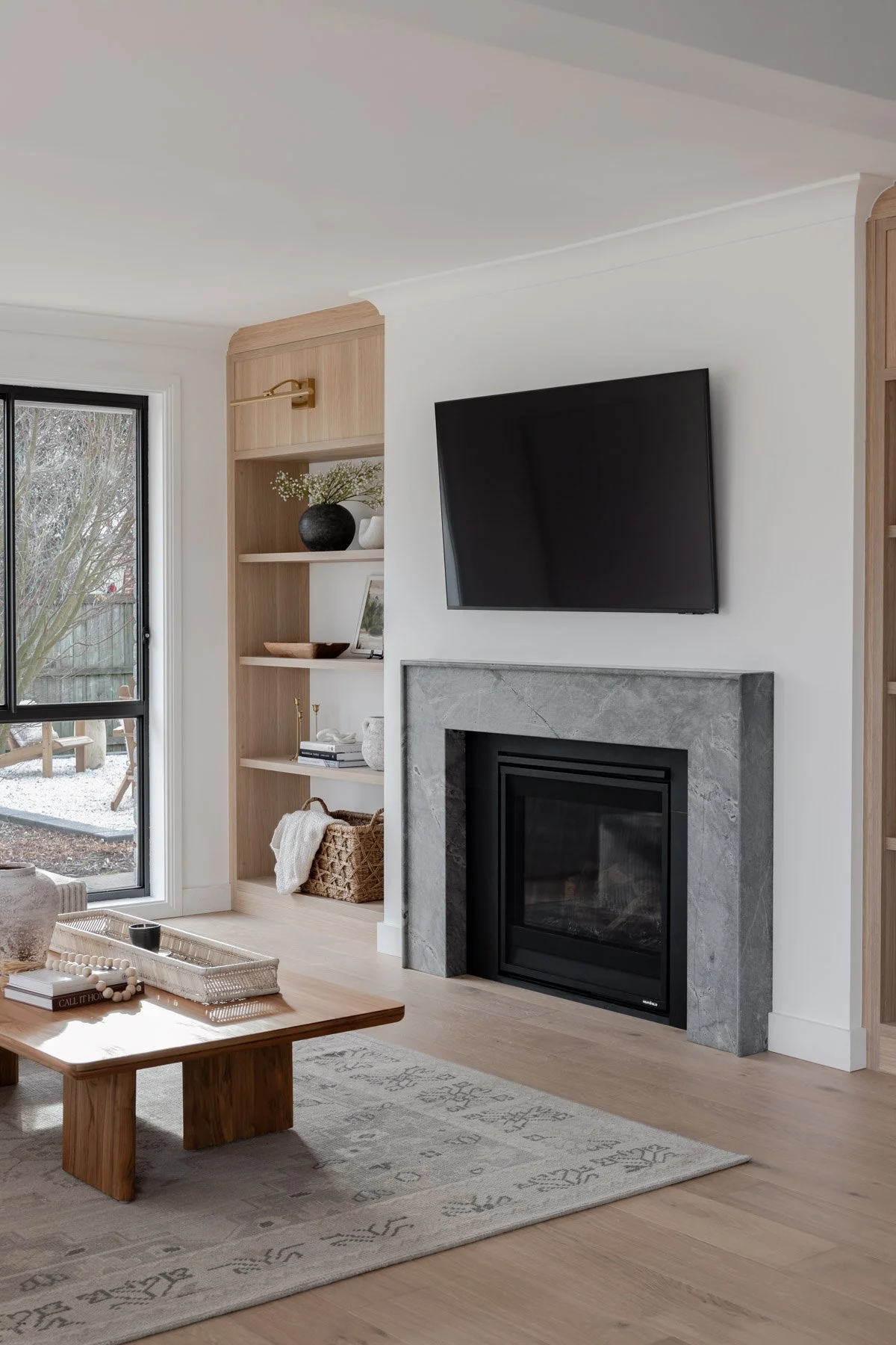 Living room fireplace with built in timber shelving, Bowral country home