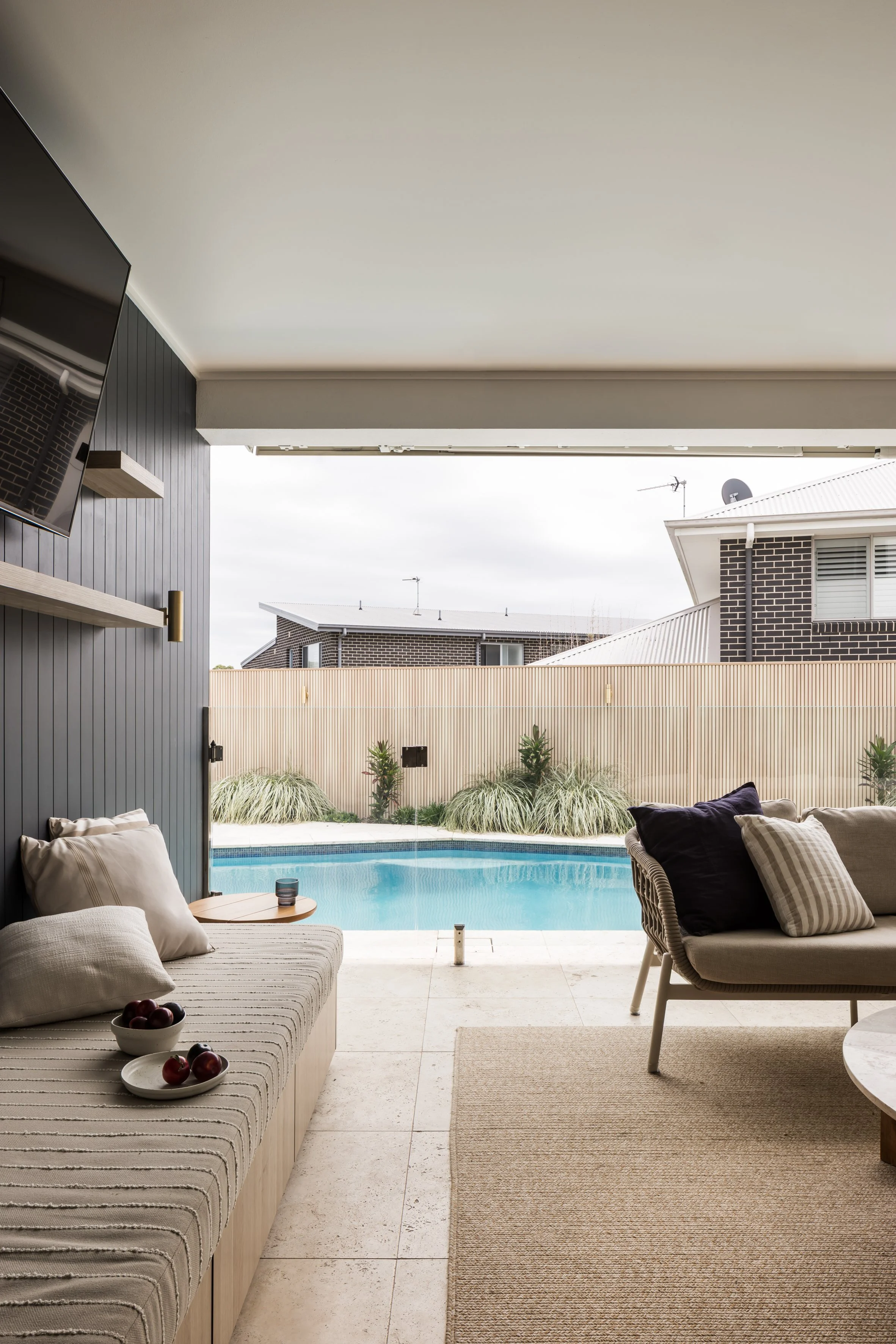 Pool area with NewTechWood castellated cladding fence and new lighting, Shell Cove