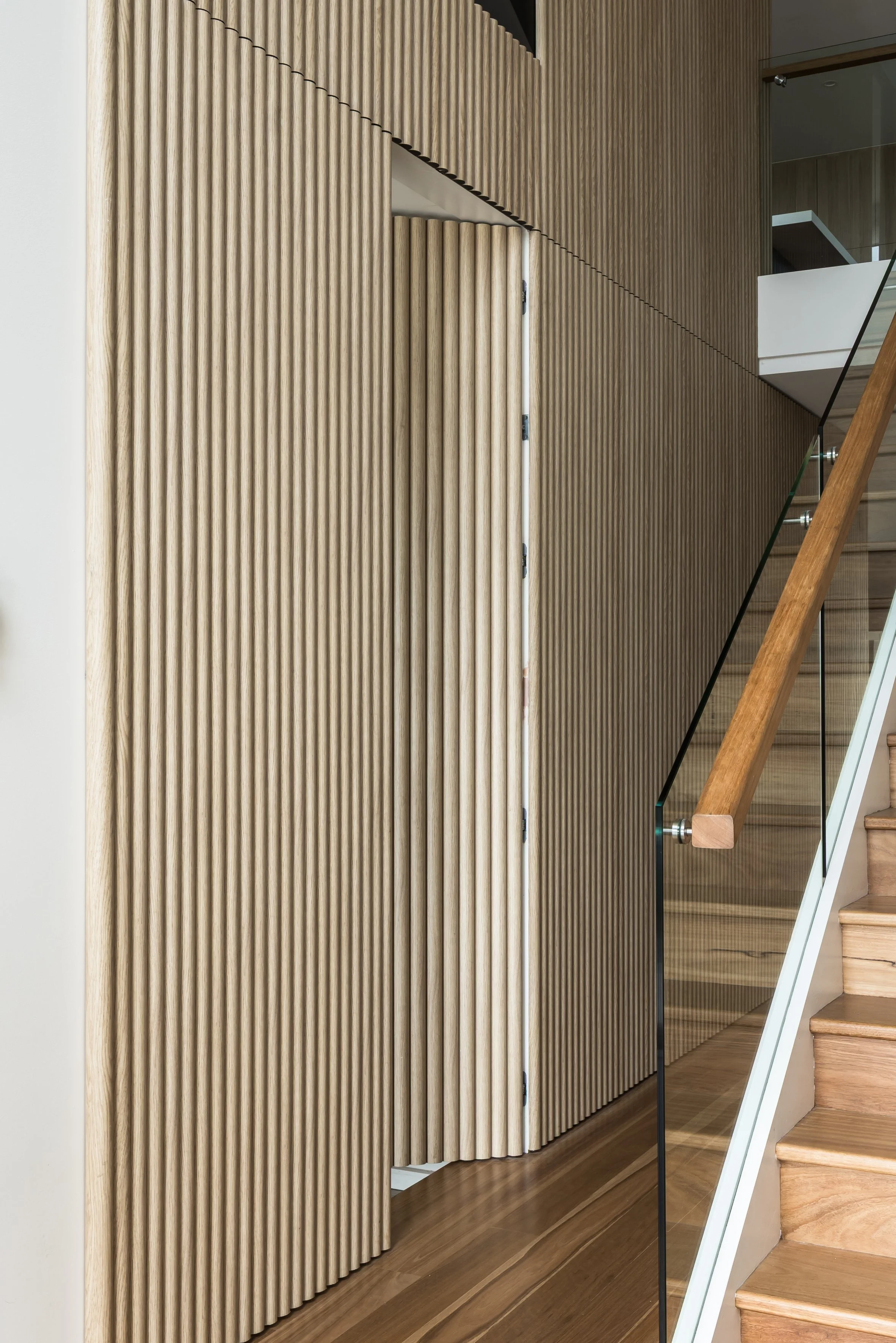 Hidden door concealed in the fluted timber wall, Shell Cove