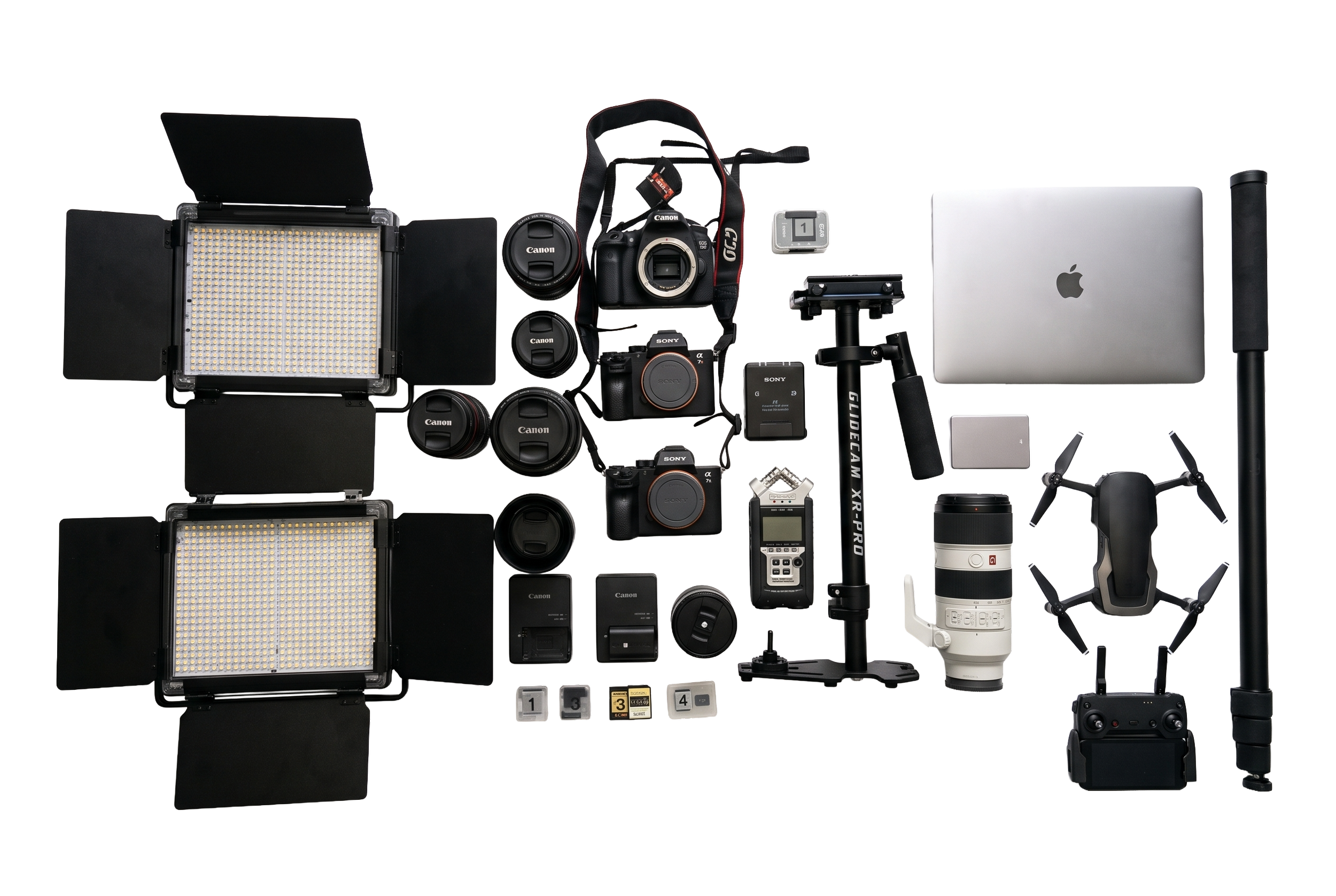 Collection of professional photography equipment including cameras, lenses, lights, tripod, and accessories arranged on a black background.