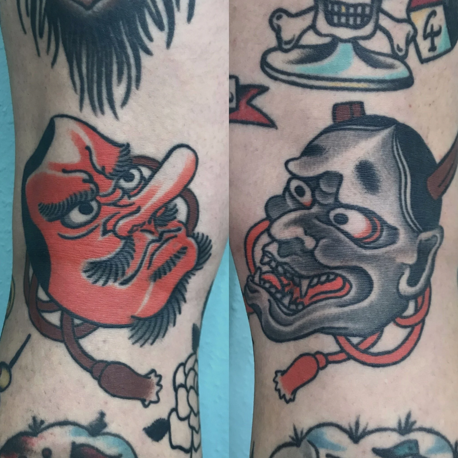 Nahaufnahme eines farbenfrohen Japan-Tattoos mit zwei stilisierten Hannya Masken