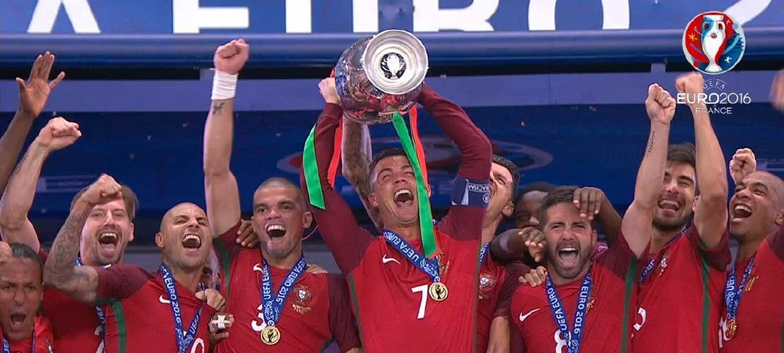 Portugal soccer team celebrating with the UEFA Euro 2016 trophy
