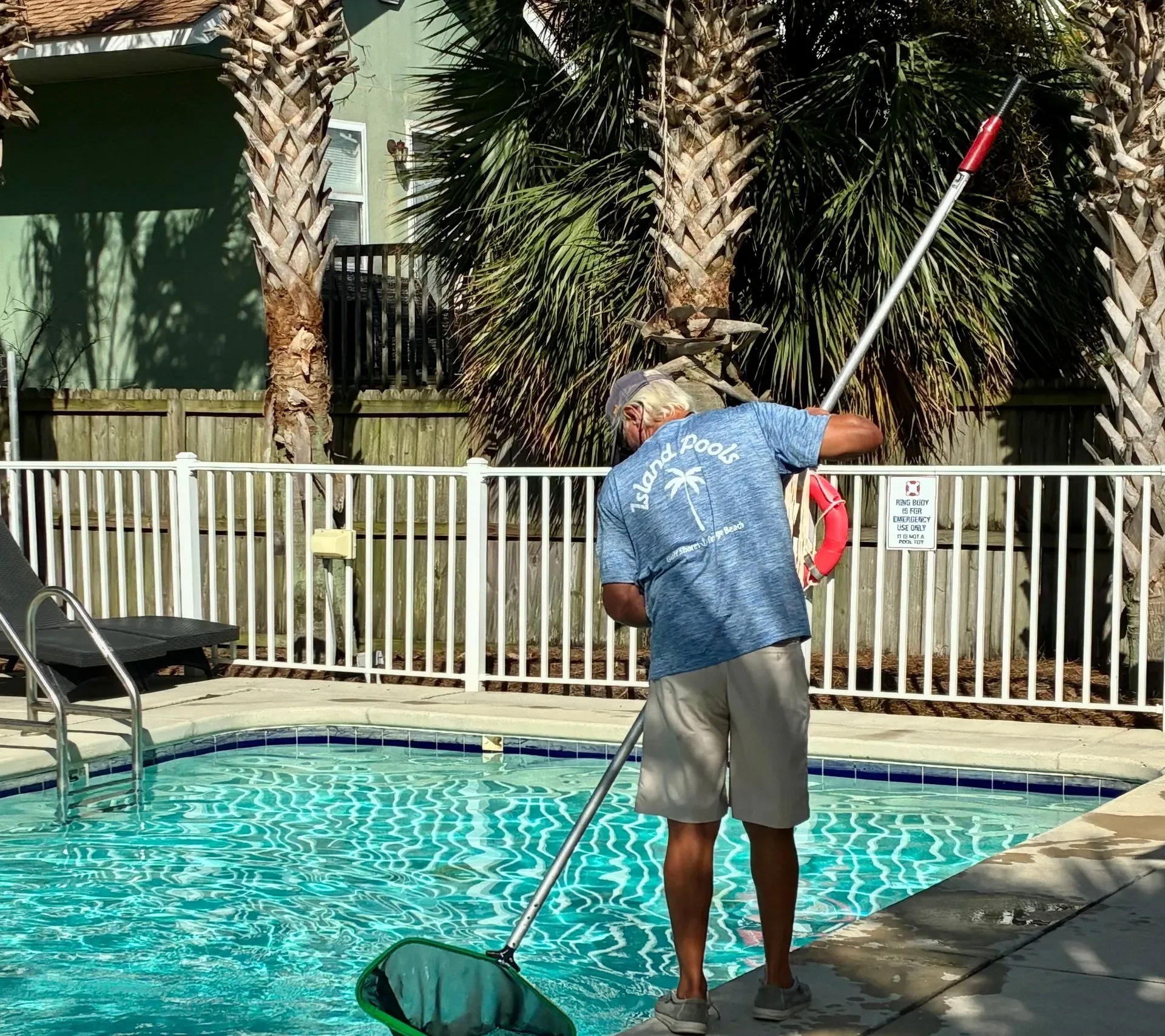 Ralph Gold Cleaning a Pool