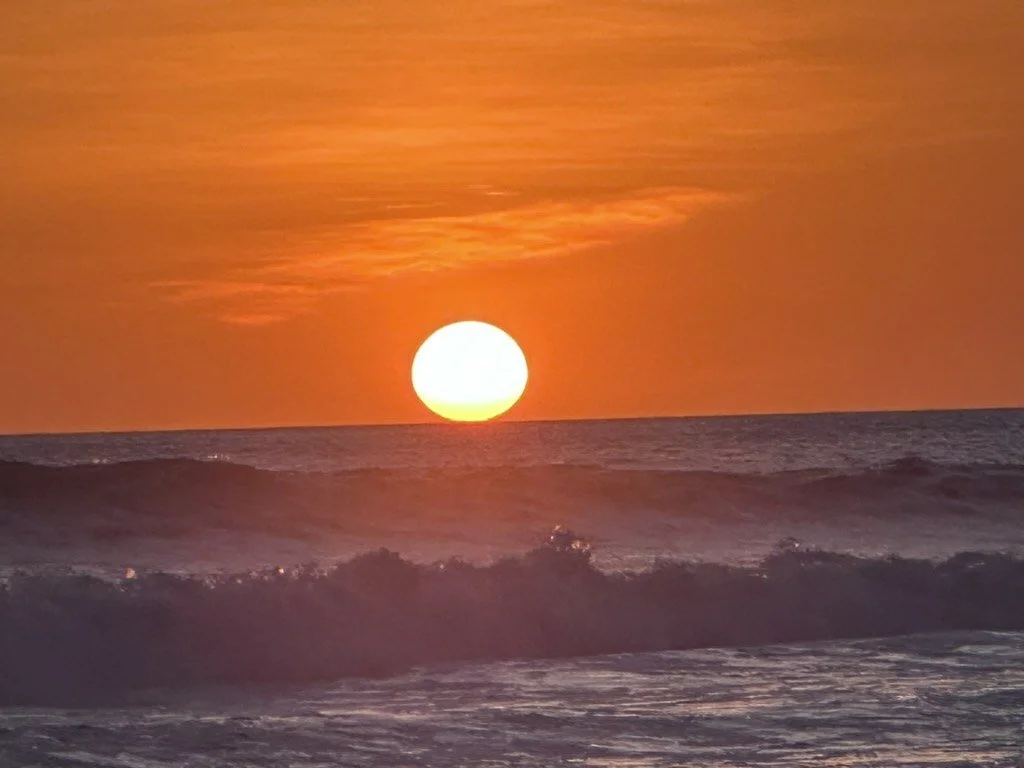 Sunset over the Pacific waves at Playa Grande, Guanacaste, Costa Rica