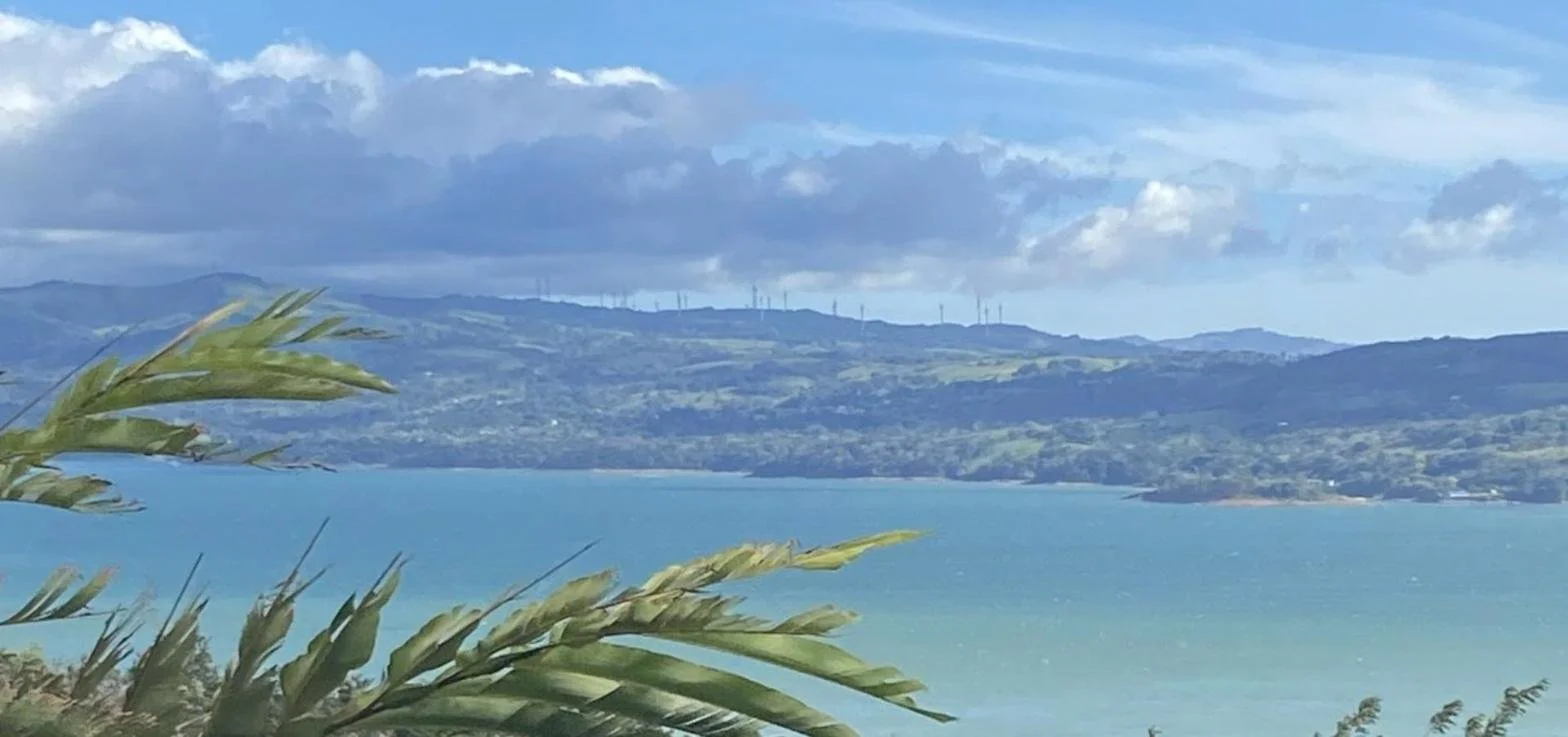 Lake Arenal in Costa Rica, with the wind turbines of the Tilarán hills, a scenic stop on a Guanacaste road trip