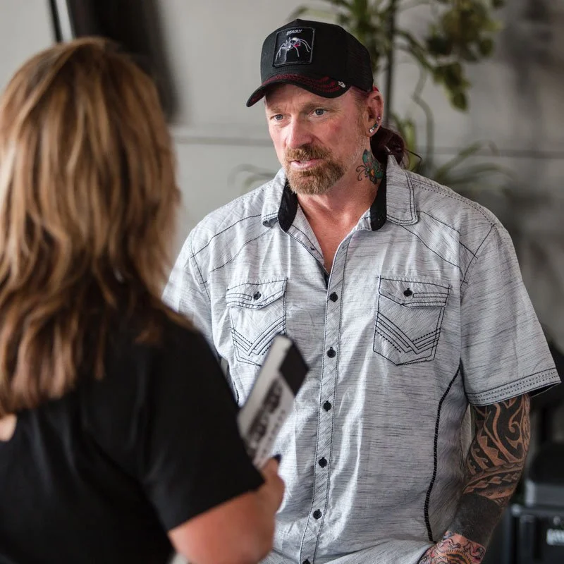 Navy SEAL veteran Darren McBurnett greets guests after a motivational presentation.