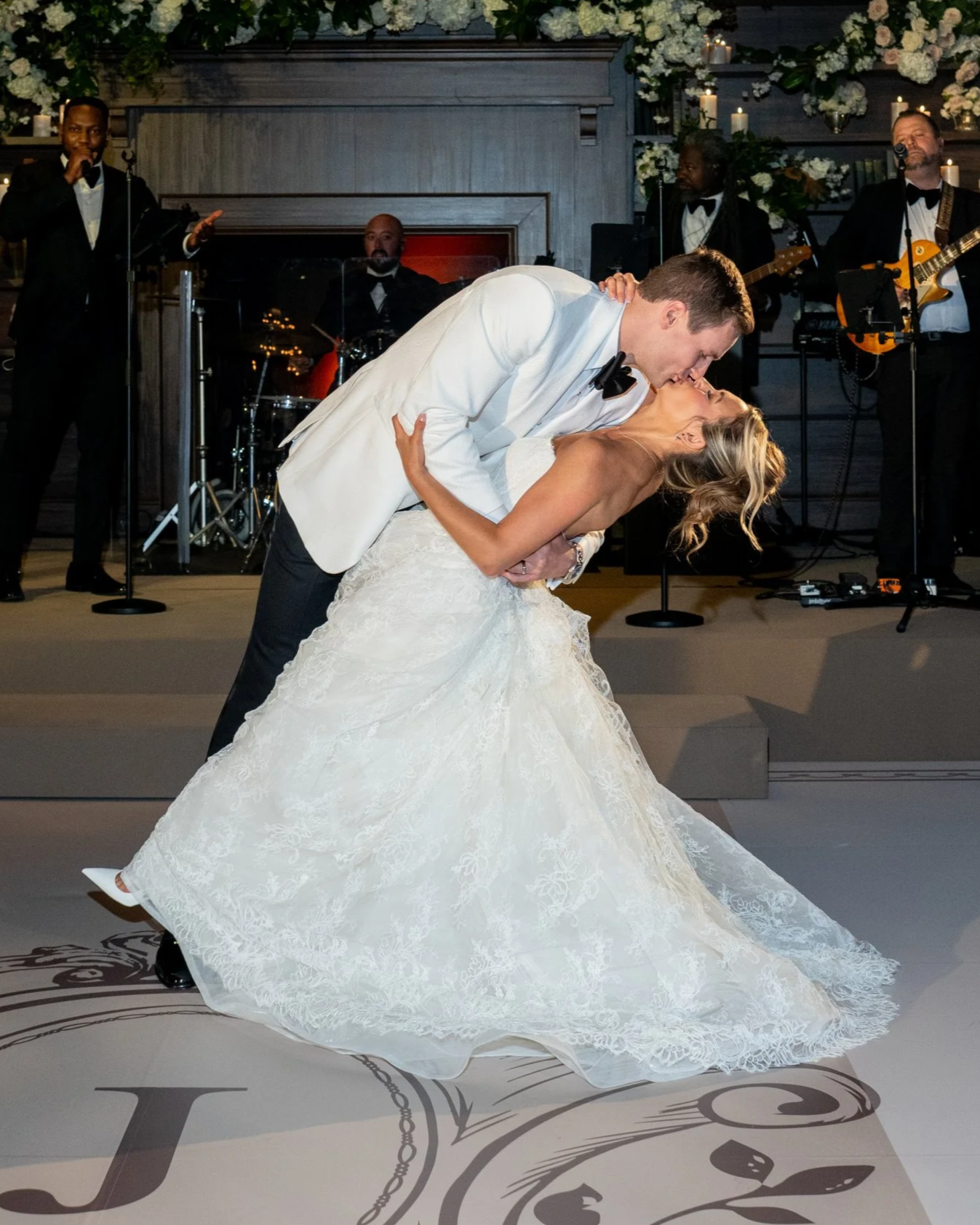 Bride and groom sharing a first-dance dip at their wedding reception