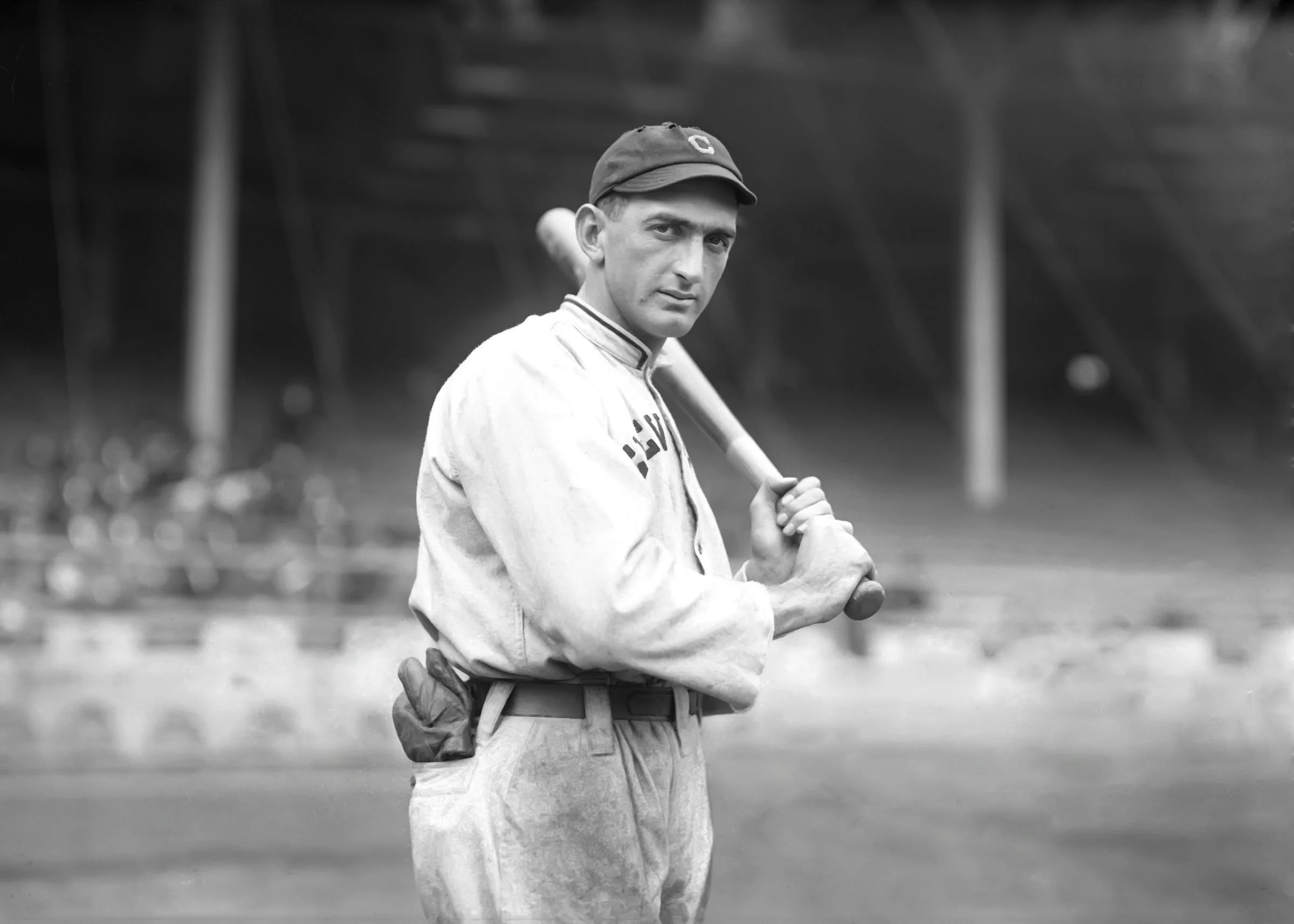 Shoeless Joe Jackson holds his bat Black Betsy while playing for the Cleveland Naps in 1913.