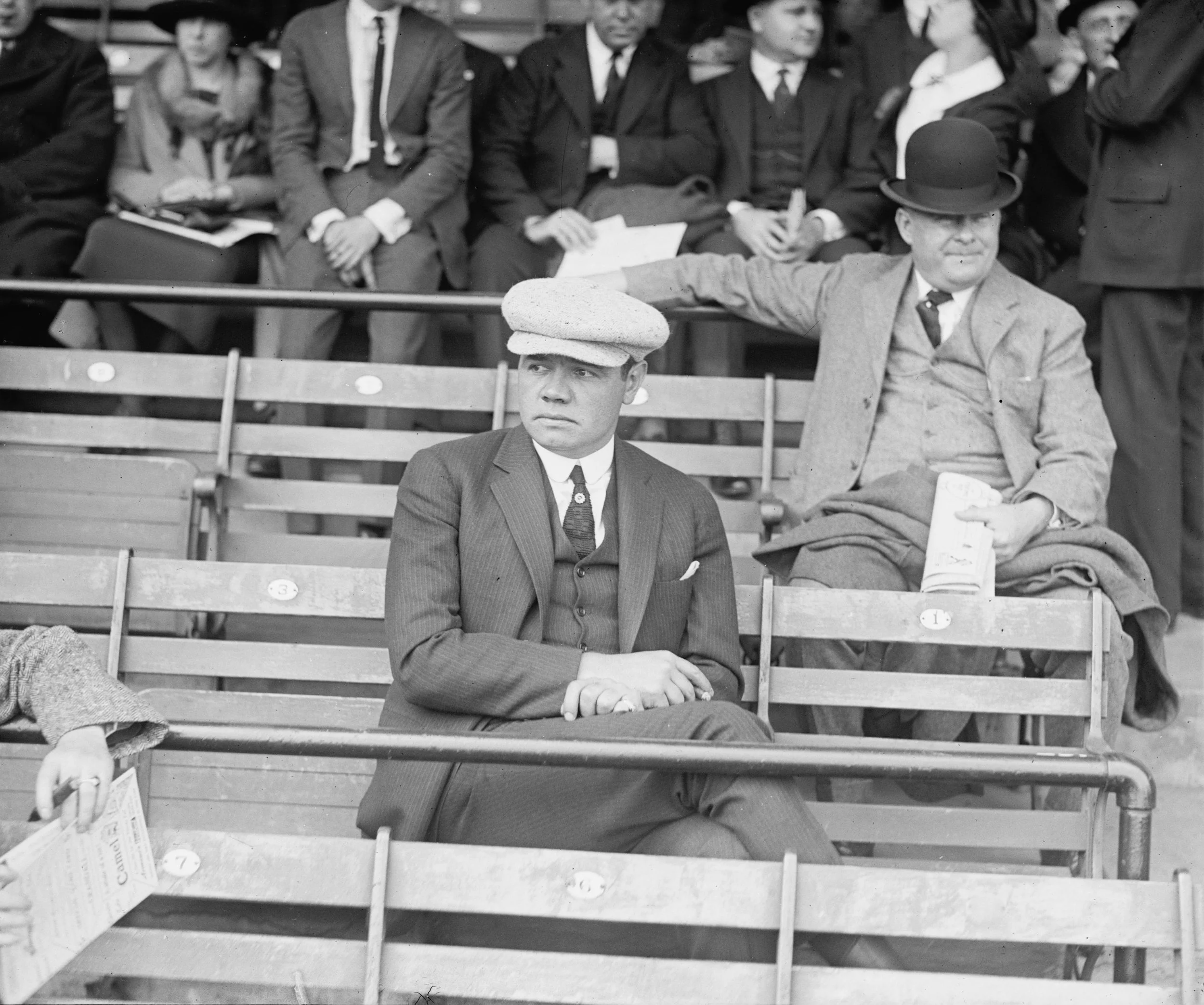 Babe Ruth seated in the stands at Griffith Stadium in Washington, D.C., on Opening Day in 1922.
