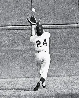 Willie Mays makes his famous over-the-shoulder catch during Game 1 of the 1954 World Series at the Polo Grounds.