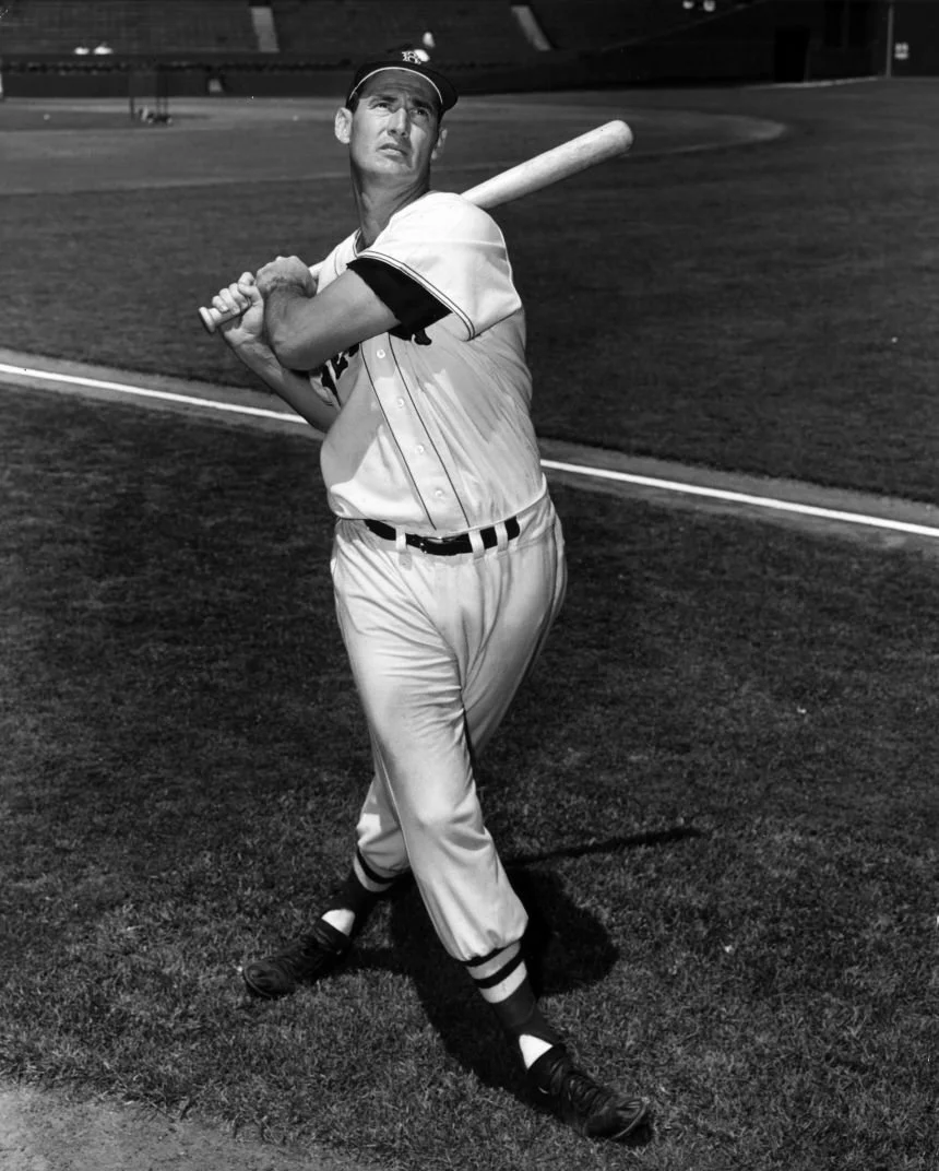 Ted Williams of the Boston Red Sox posing with a bat in 1951.