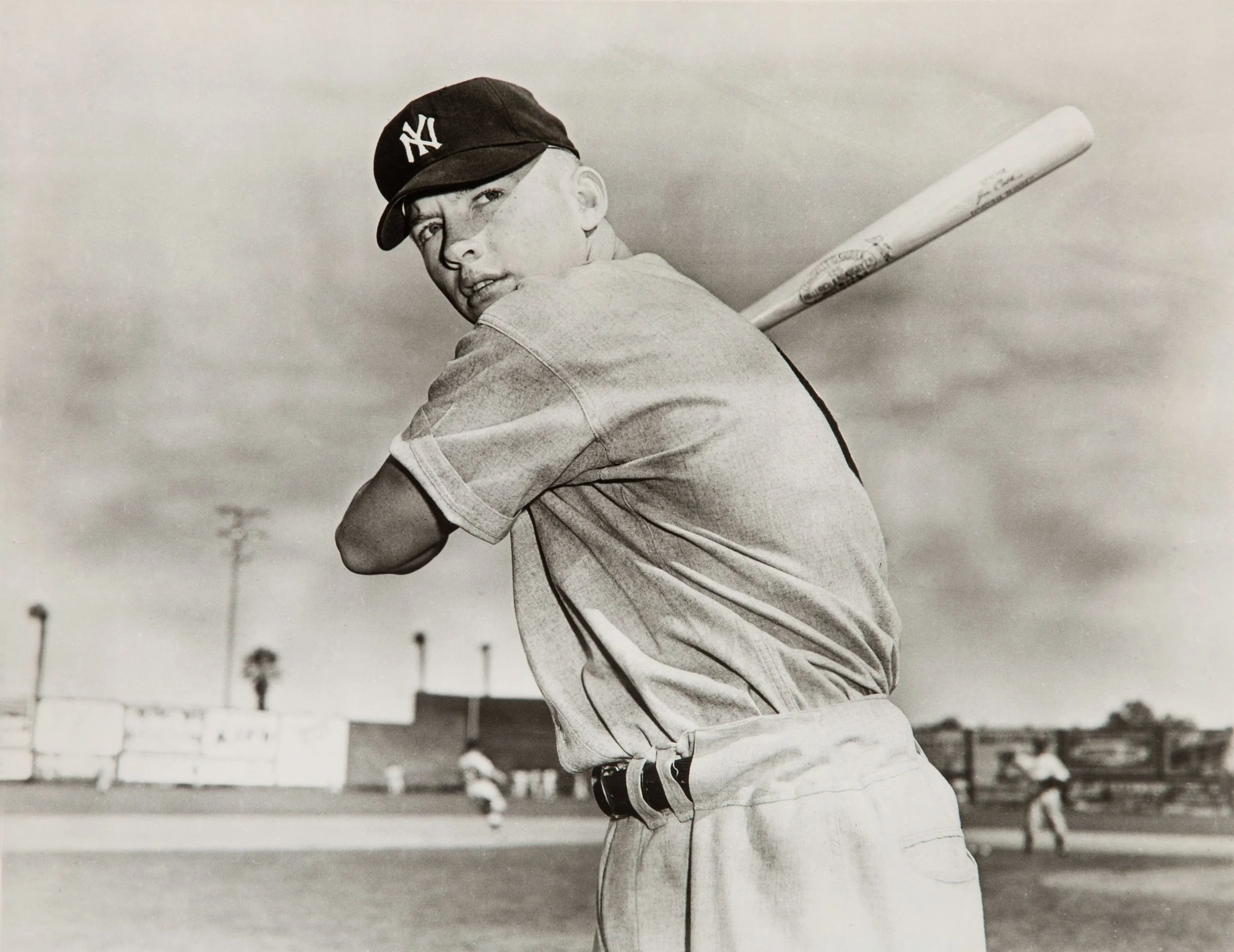 Nineteen-year-old Mickey Mantle posing with a bat during spring training with the New York Yankees in 1951.