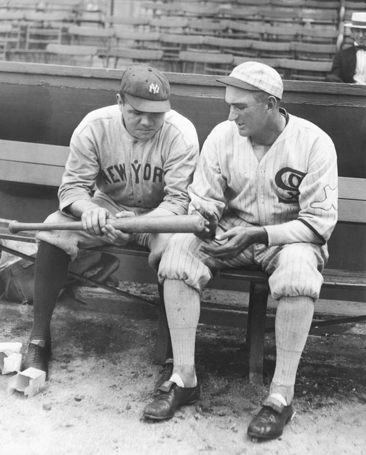 Babe Ruth and Shoeless Joe Jackson examine one of Ruth's home run bats in 1920.