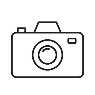 Outline of a camera with a lens in the center, a small rectangle on top, and a small square on the right side.