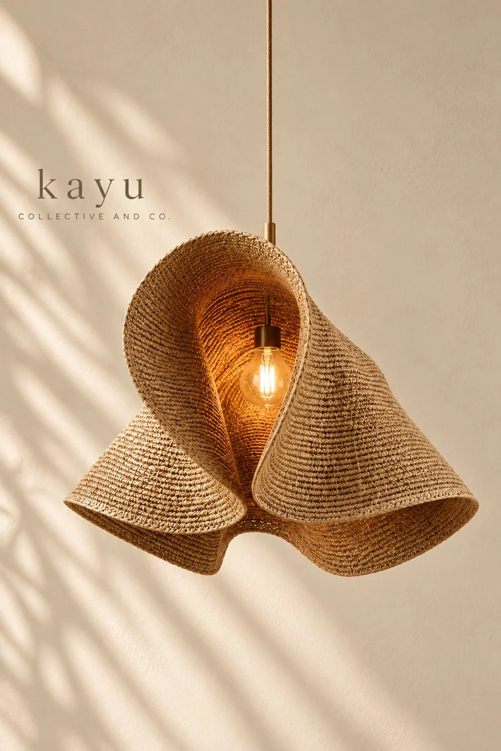 A woven rattan pendant lamp with a light bulb inside, hanging from the ceiling.