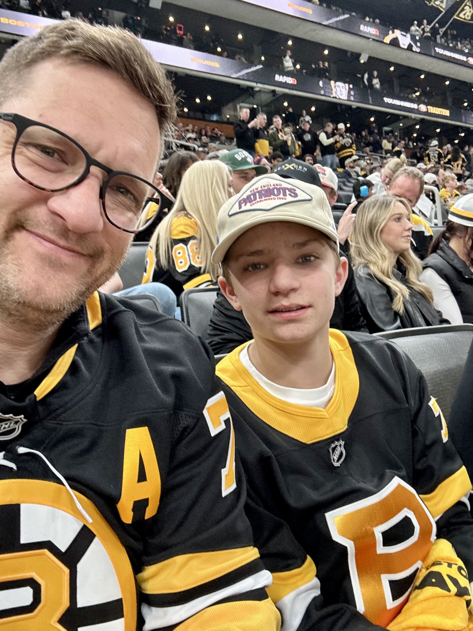 Nick and Reid Sapia in Bruins jerseys at a game at TD Garden