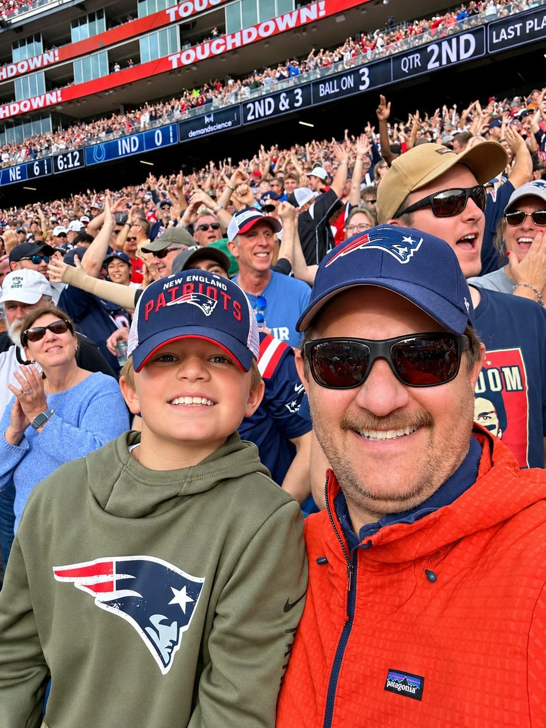 Reid and Nick celebrating a Patriots touchdown at Gillette Stadium