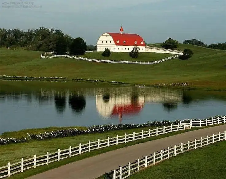 Hallmark Farms barn, white fences, and pond in Jefferson County, Alabama.