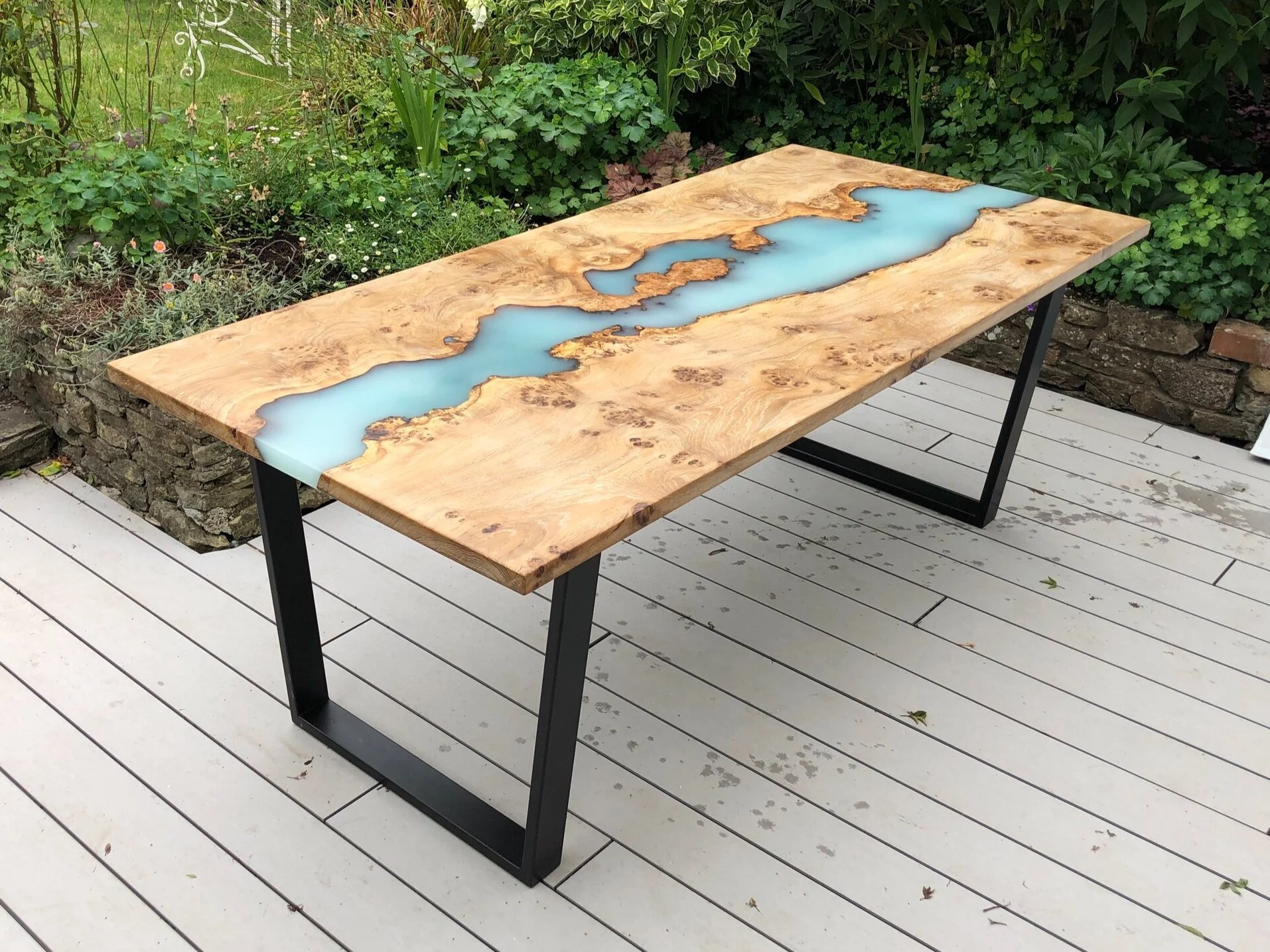 outdoor epoxy resin and wood river dining table with black powder coated steel legs Resino