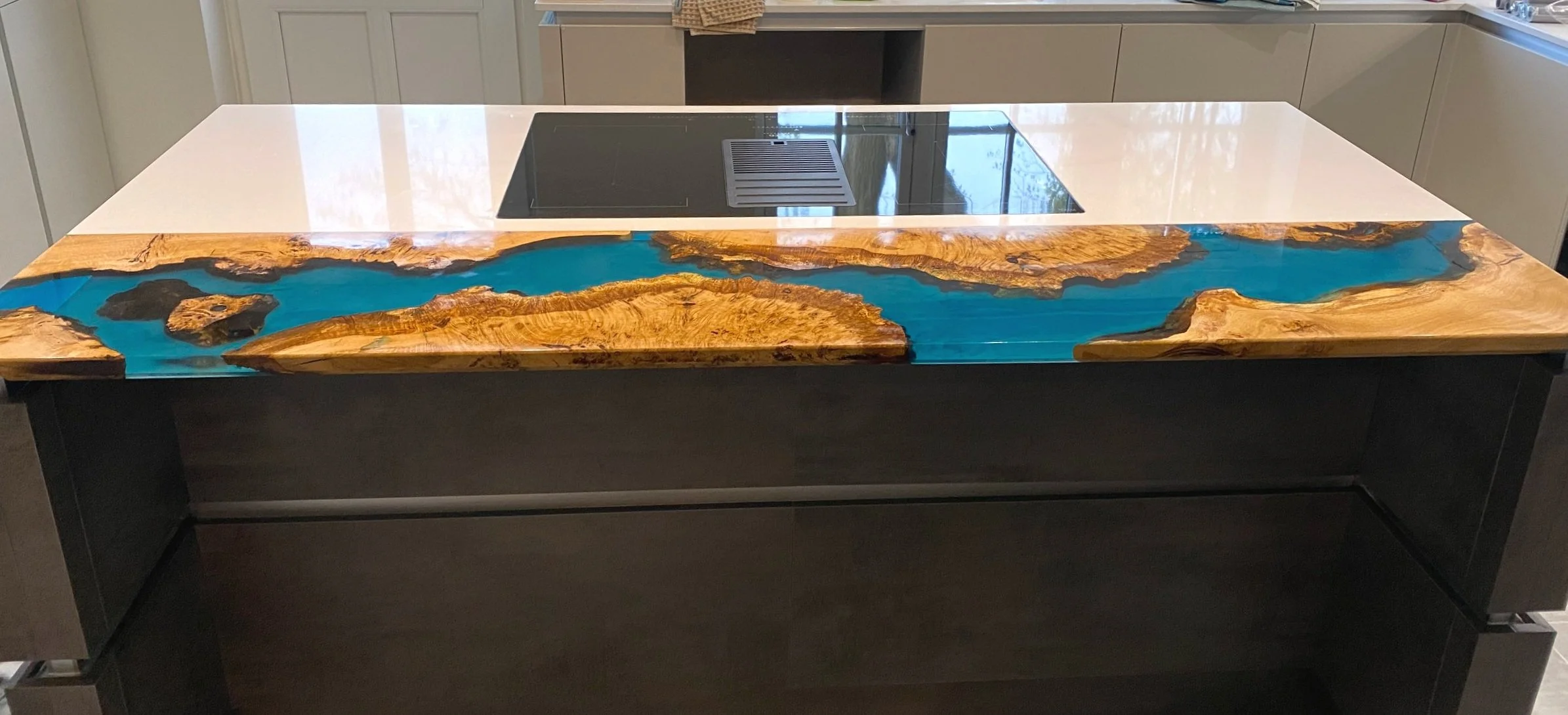 Front profile epoxy resin kitchen island extension breakfast bar with turquoise resin and oak