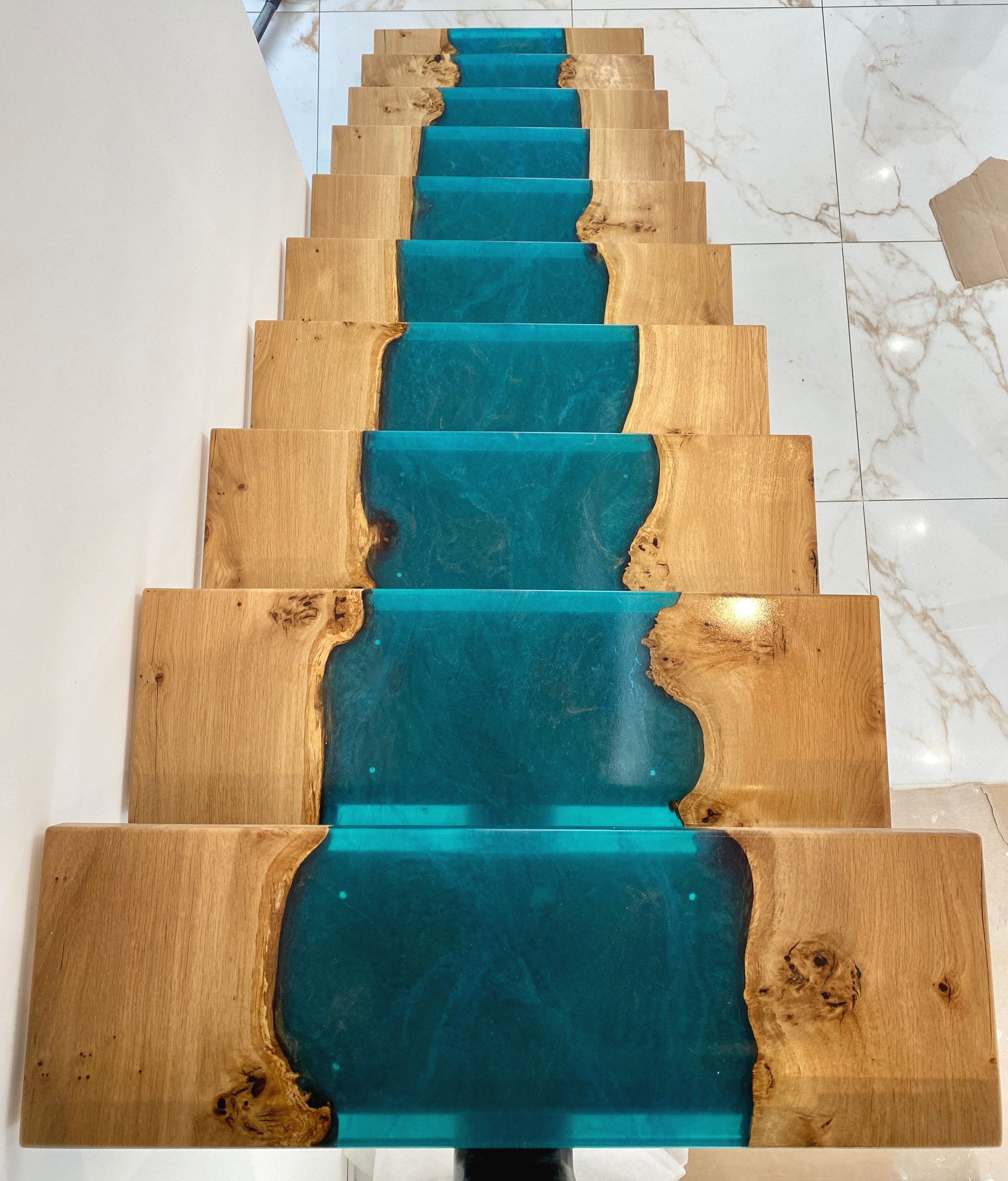 Epoxy resin stairs with turquoise river flowing down