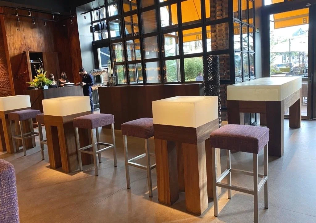 3 solid epoxy resin block tables and a DJ booth