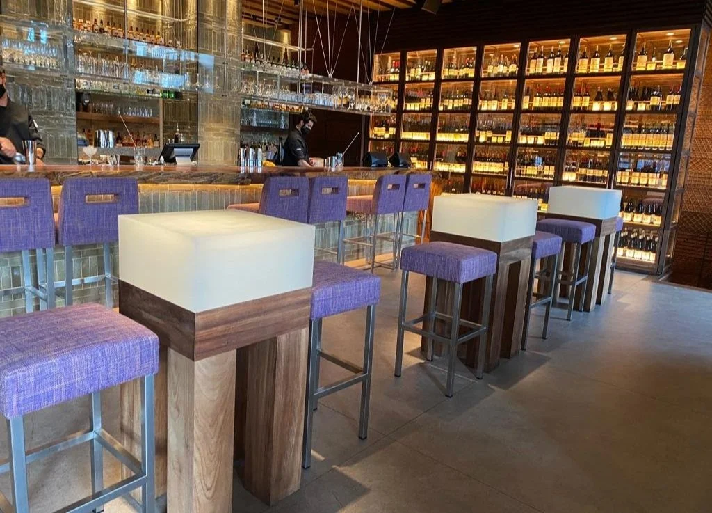 solid epoxy resin block tables with a frosted finish in Madrid restaurant