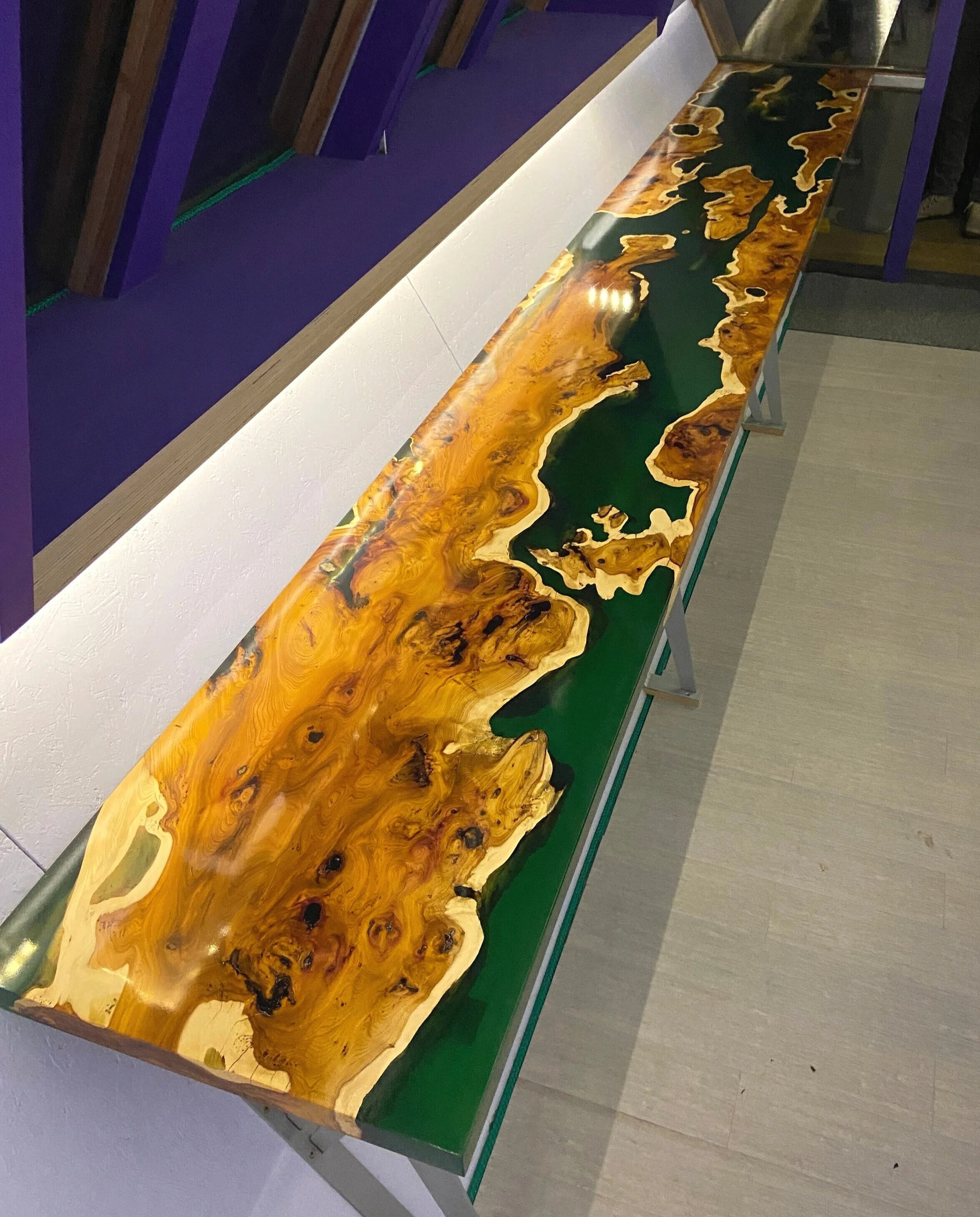 emeralg green epoxy resin and wood desk in garden office angle image showing full length against angled wall