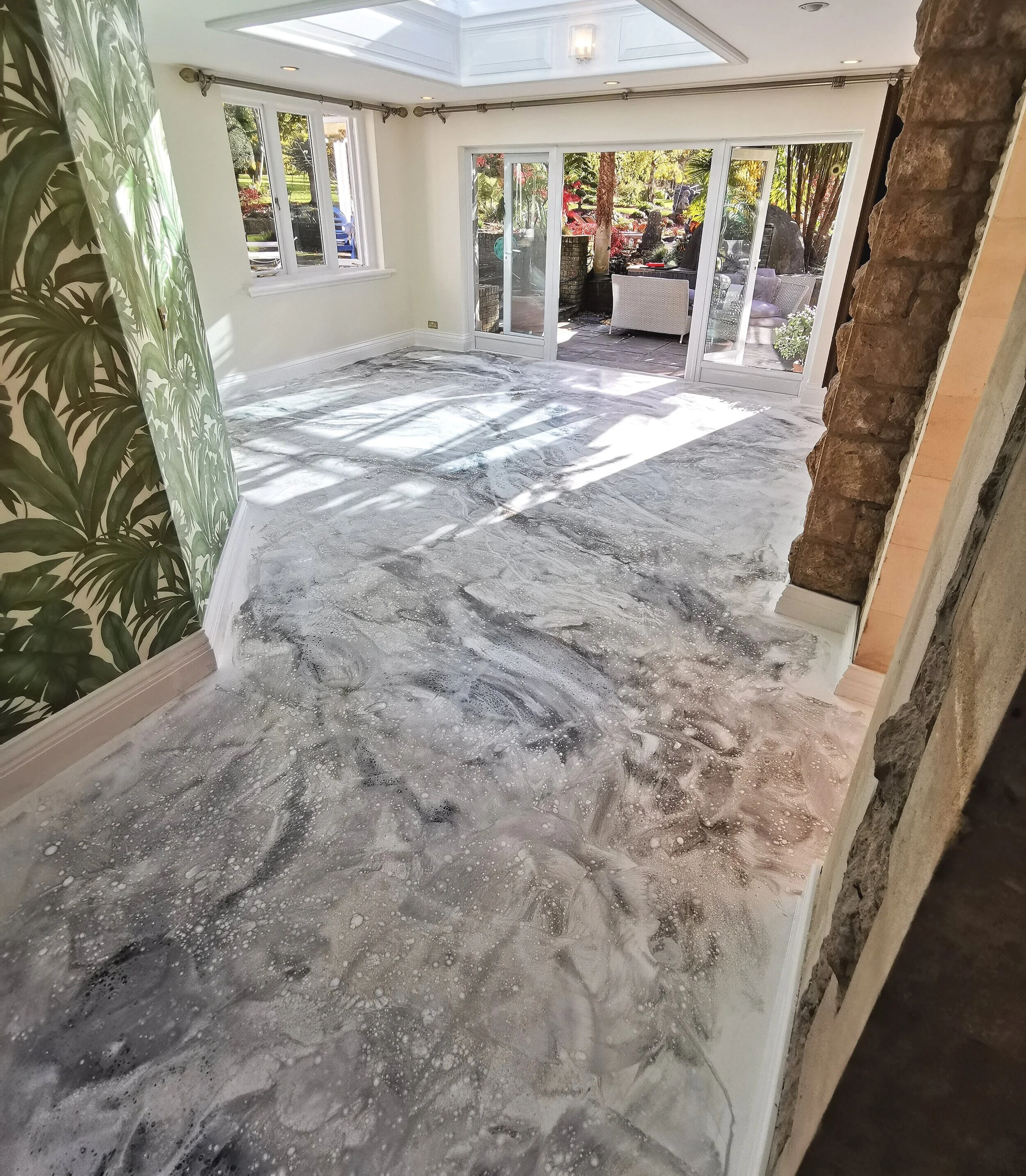 marble effect resin floor with doors in background