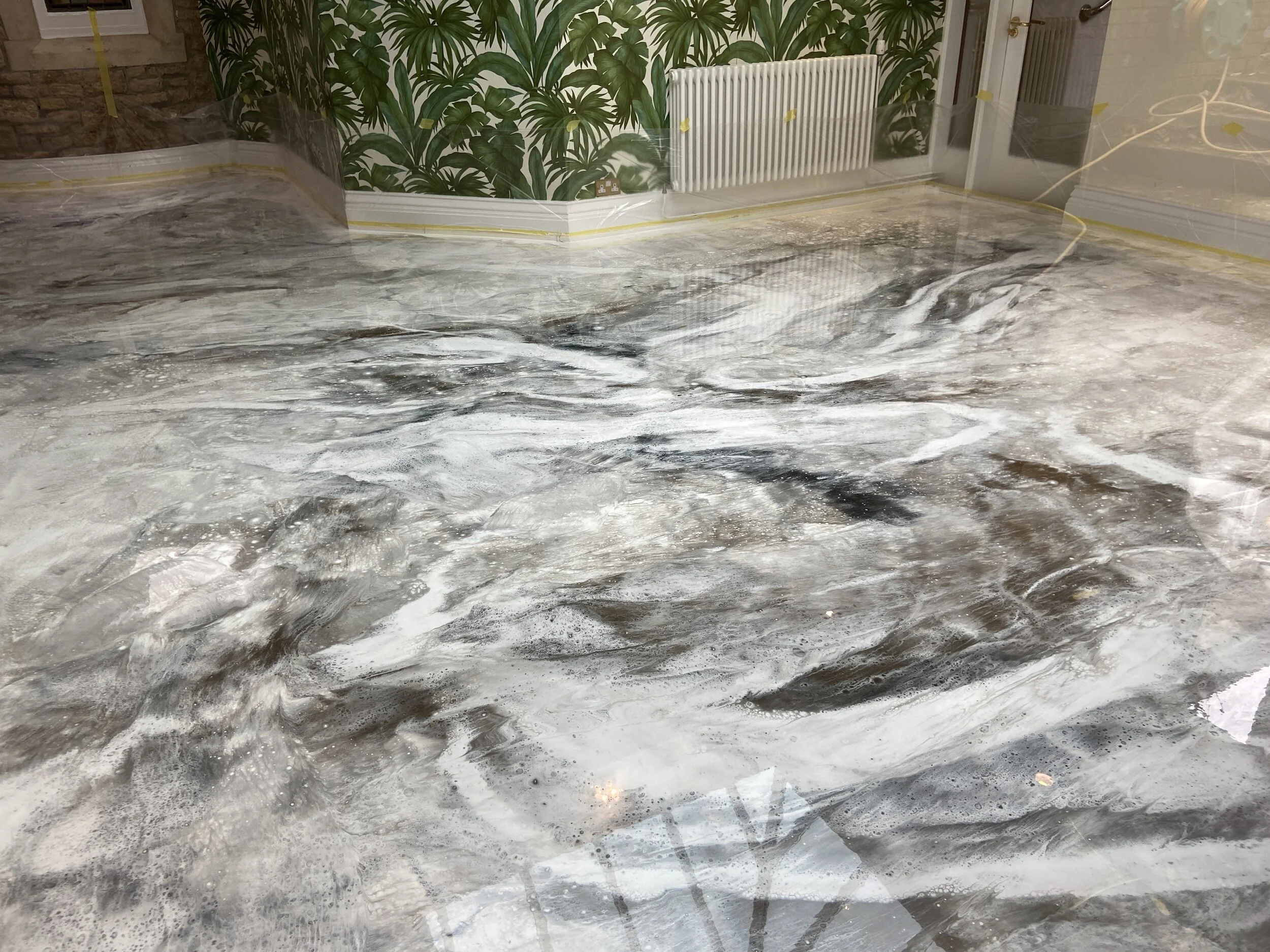 black, white, silver and gold resin floor