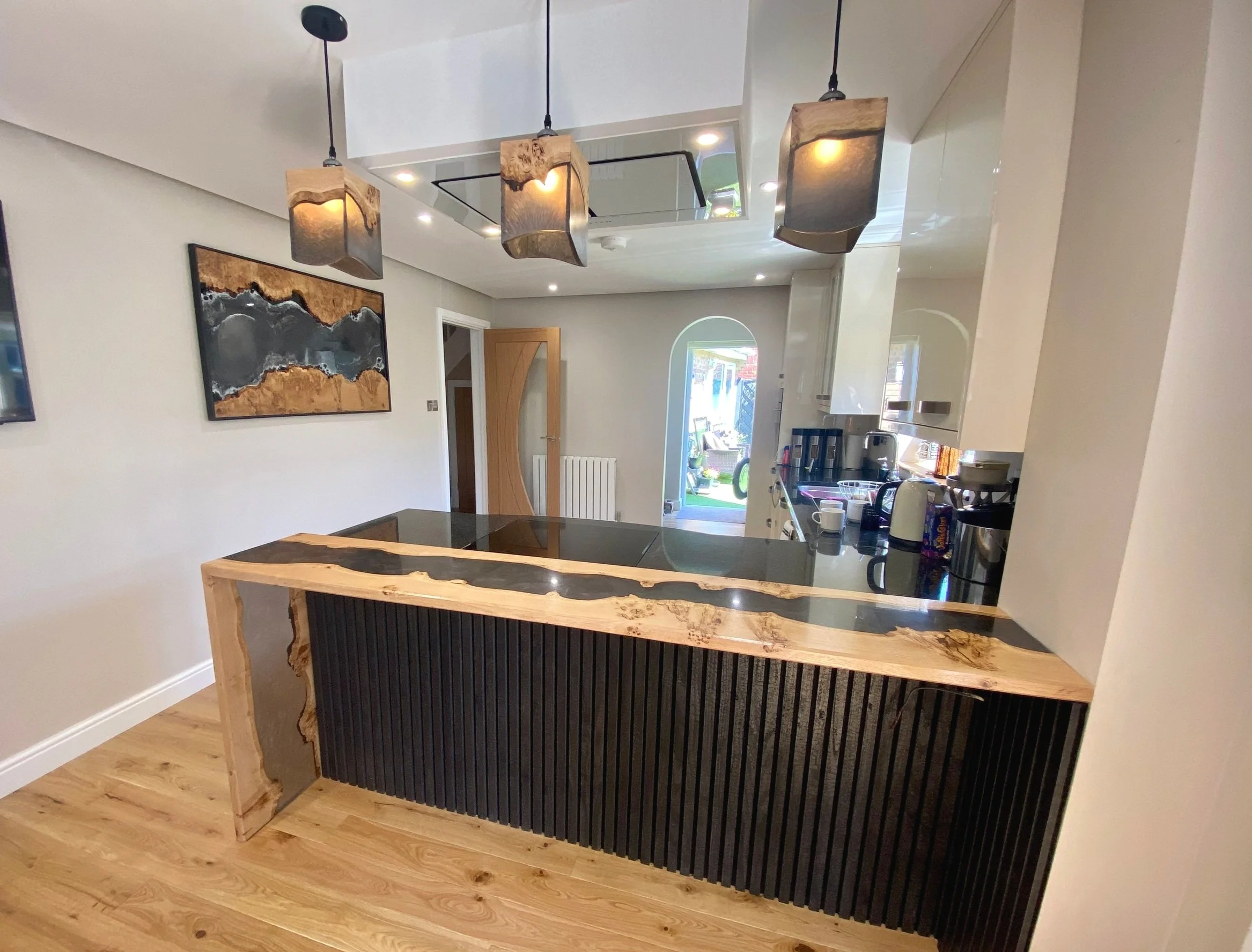 Waterfall Leg Breakfast Bar with Matching Wall Art and Pendant Lamps