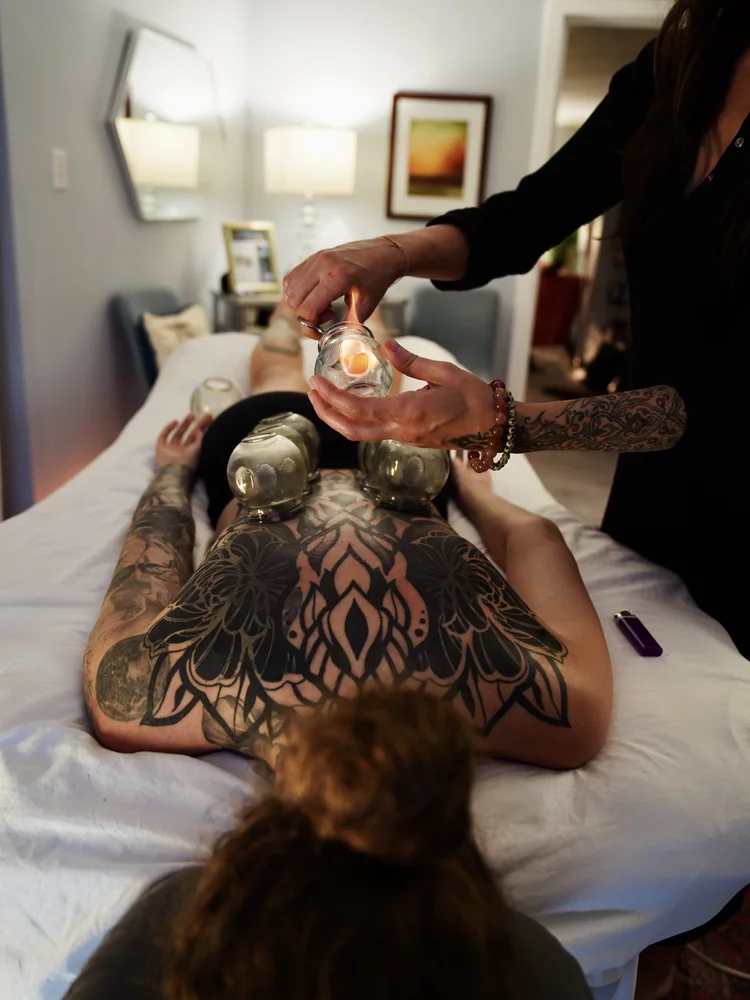 Fire cupping treatment in progress at the Gulfport studio