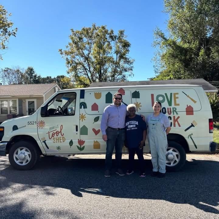 Scott Conger standing with team members in front of the Love Your Block van
