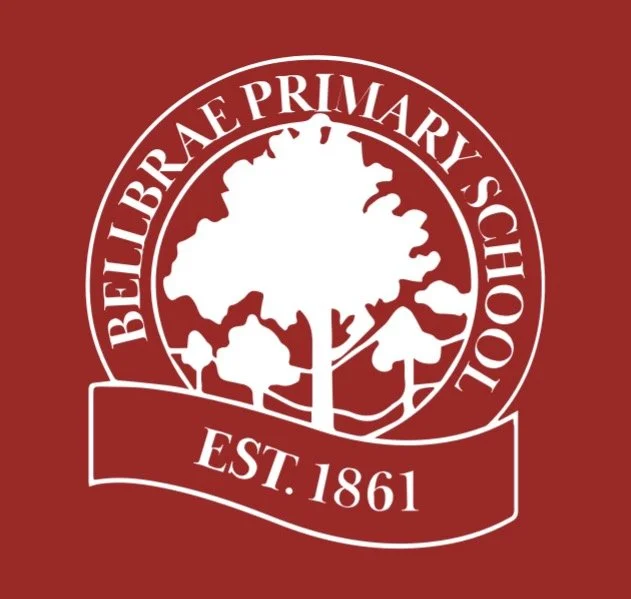 Logo of Belfaire Primary School with a tree, established in 1861, on a red background.