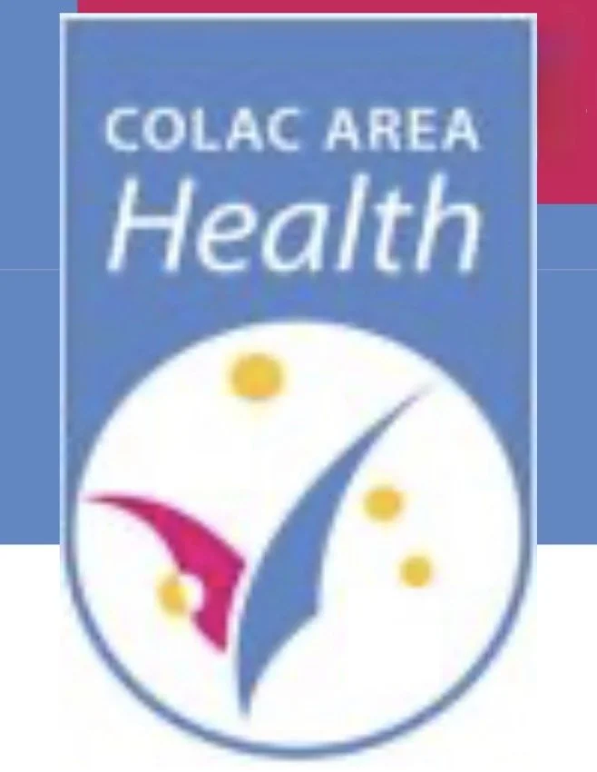 Logo for Colac Area Health featuring a clock with yellow dots and a pink and blue design