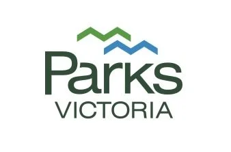 Logo for Parks Victoria featuring three stylized mountain shapes in green and blue above the text 'Parks Victoria'.