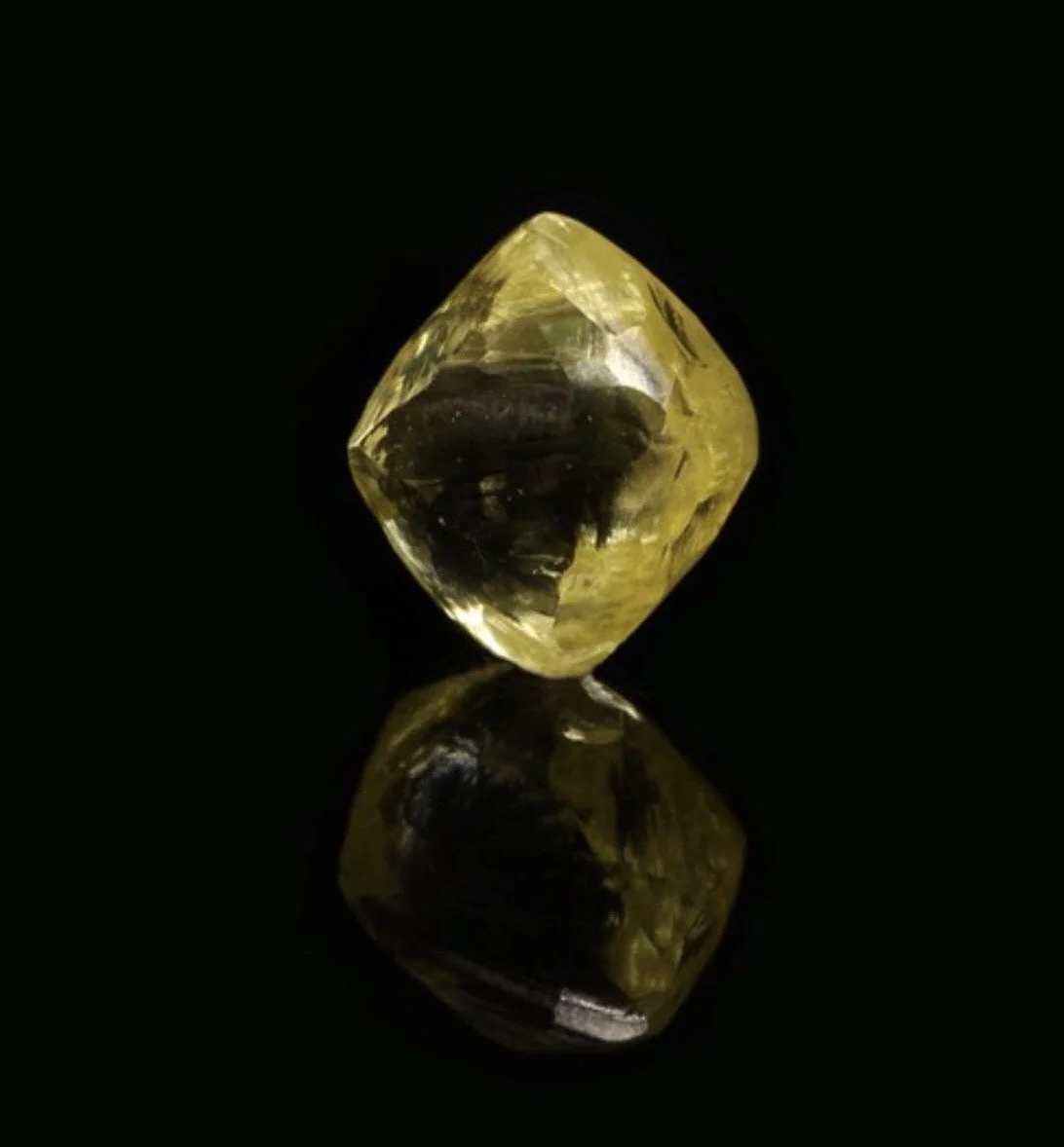 A clean rough alluvial yellow diamond with a clear, smooth skin