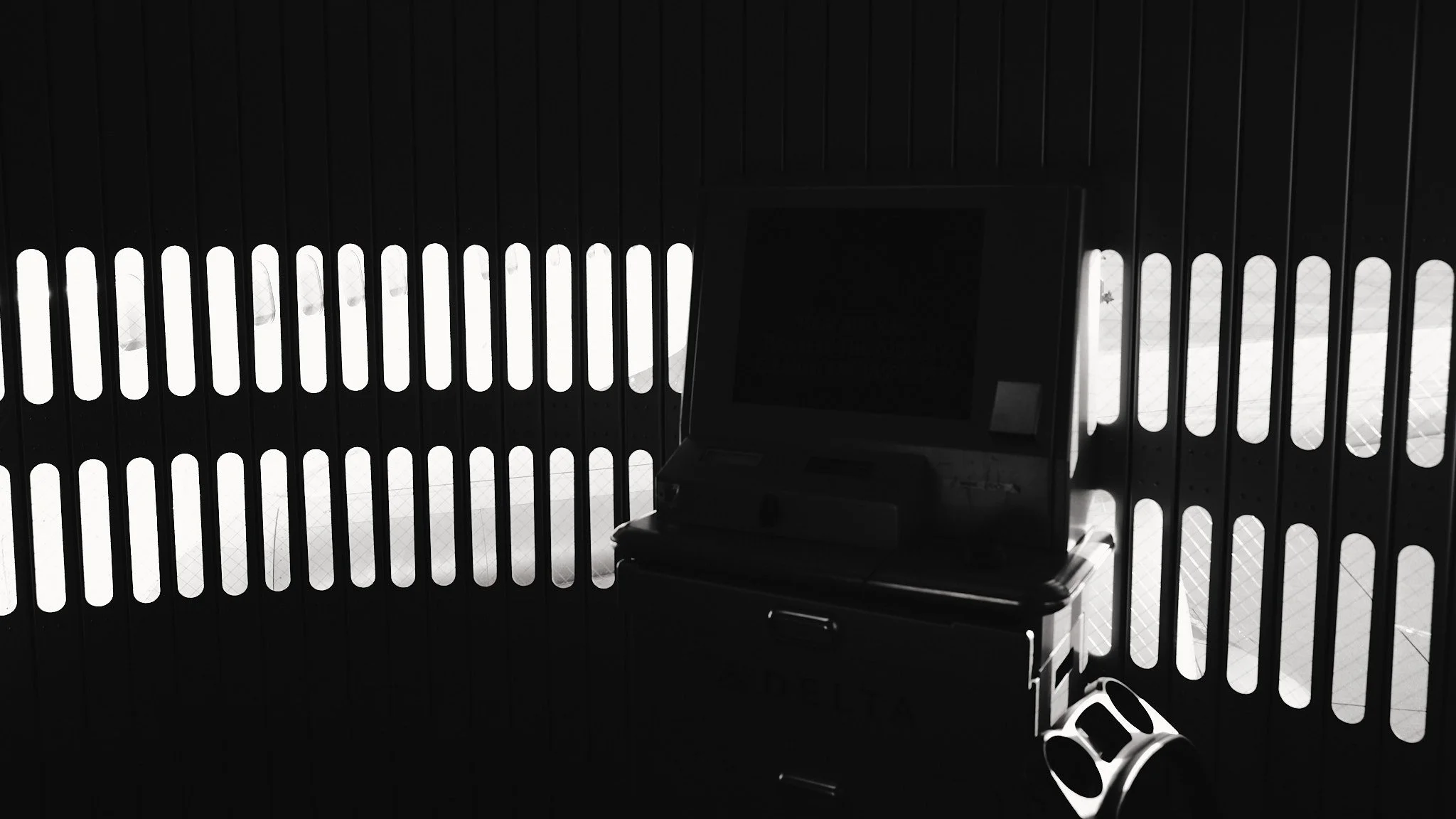 A dark room with an empty ATM machine in front of a barred window, with light coming through the window  by Matt Ellis