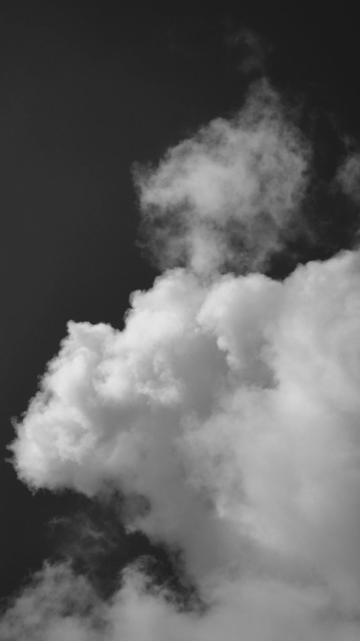 Black and white photograph of clouds in the sky.